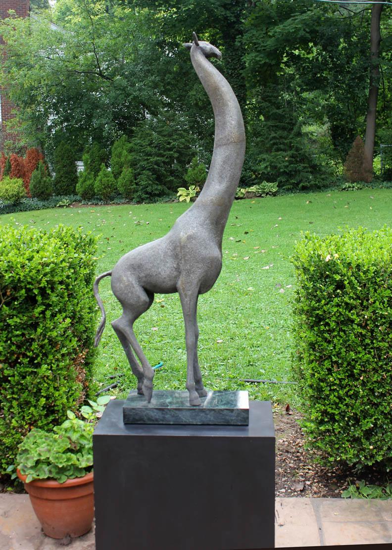 A large and early sand cast aluminum  Modernist sculpture of a giraffe by  Cuban American artist Manuel Carbonell. Pedestal included. Height is 73” with base.  Presented by Joseph Dasta Antiques.
Carbonell’s   early sculptures where sand cast and