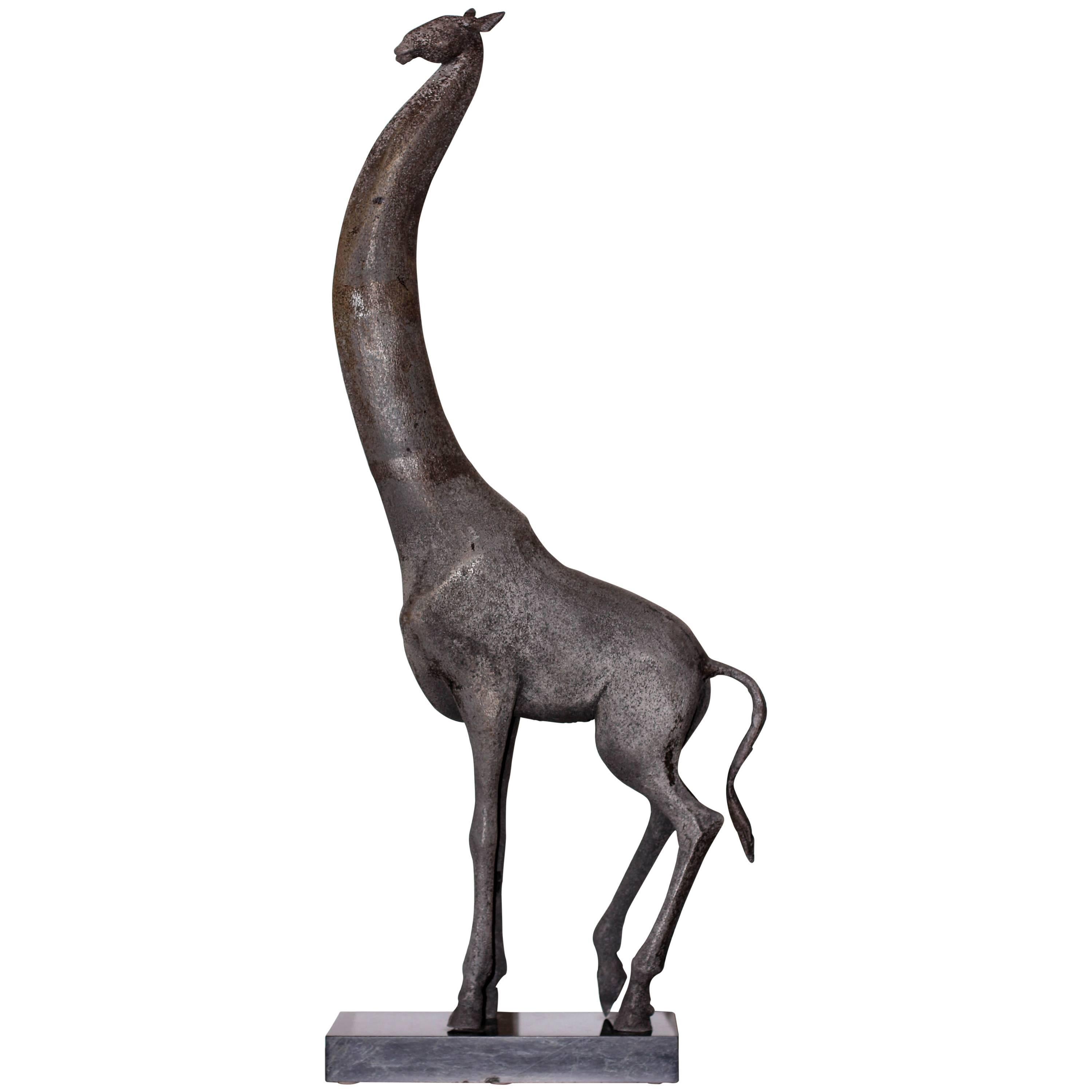 A large and early sand cast aluminum modernist sculpture of a giraffe by Cuban American artist Manuel Carbonell. Pedestal included. Measures: Height is 73” with base.
Carbonell’s early sculptures where sand cast and unique. This is an edition of