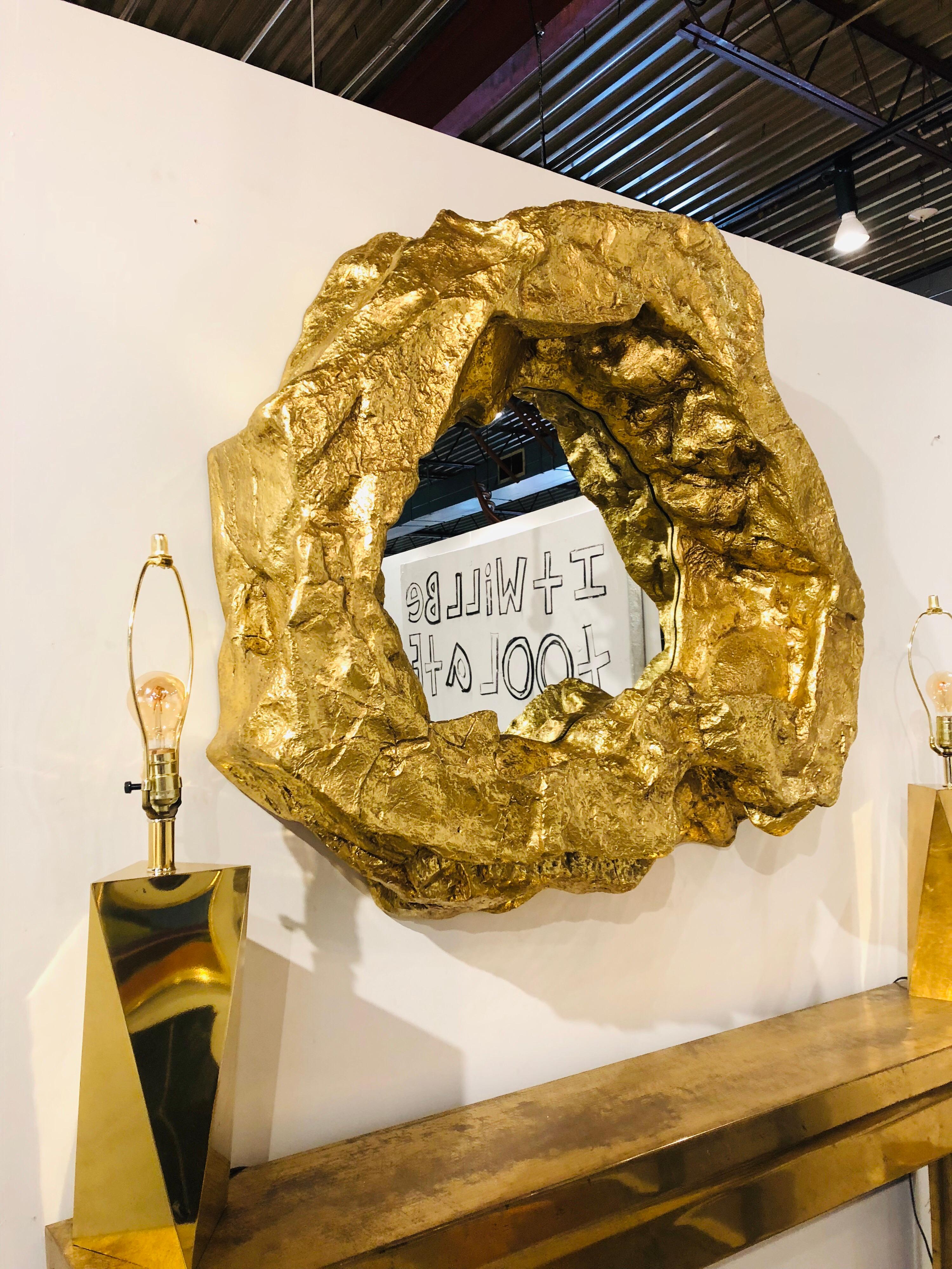 Large modern gold leaf wall mirror. Made of resin.