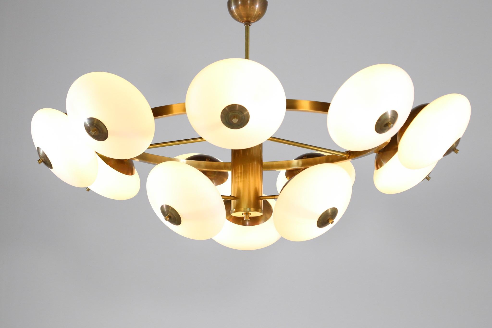 Large round contemporary chandelier in brass and opaline glasses.
E14 bulb (15w).

Can be customized.