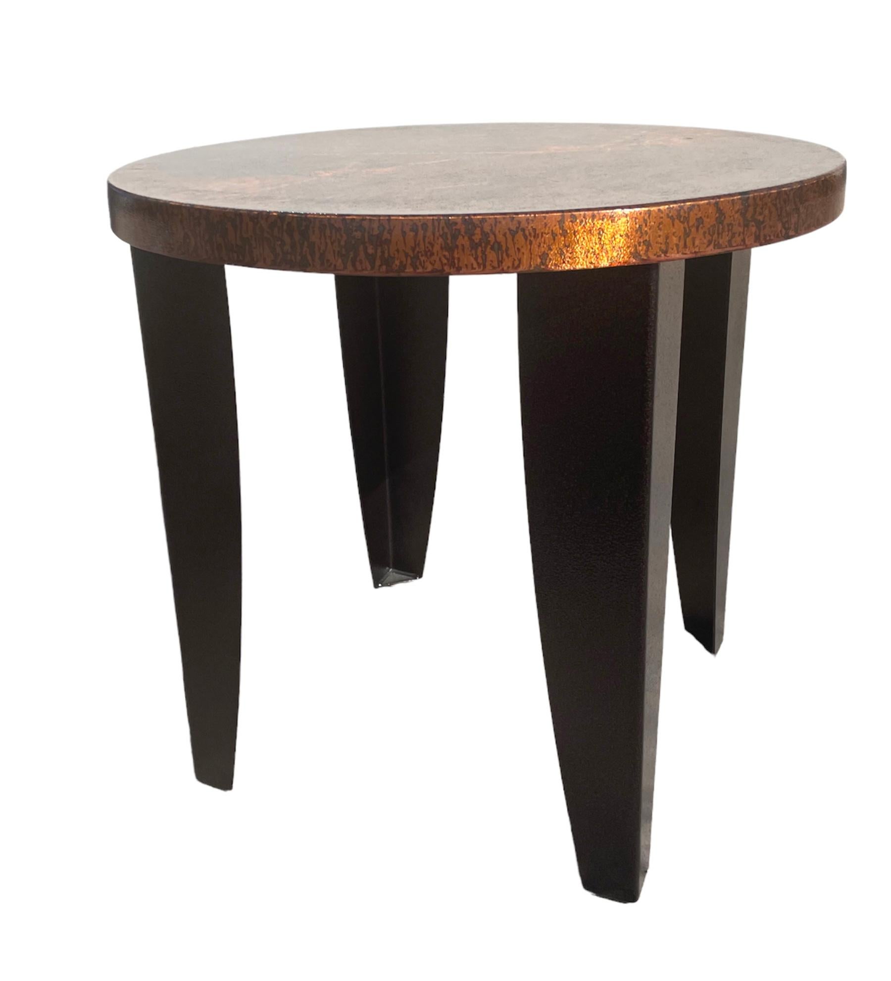 Oversized copper top and metal brownish back legs side tables, very cool look, the original owner said they were made in Mexico, vey stylish for a ranch or modern stately farm... or loft. solid and more beautiful in person.
