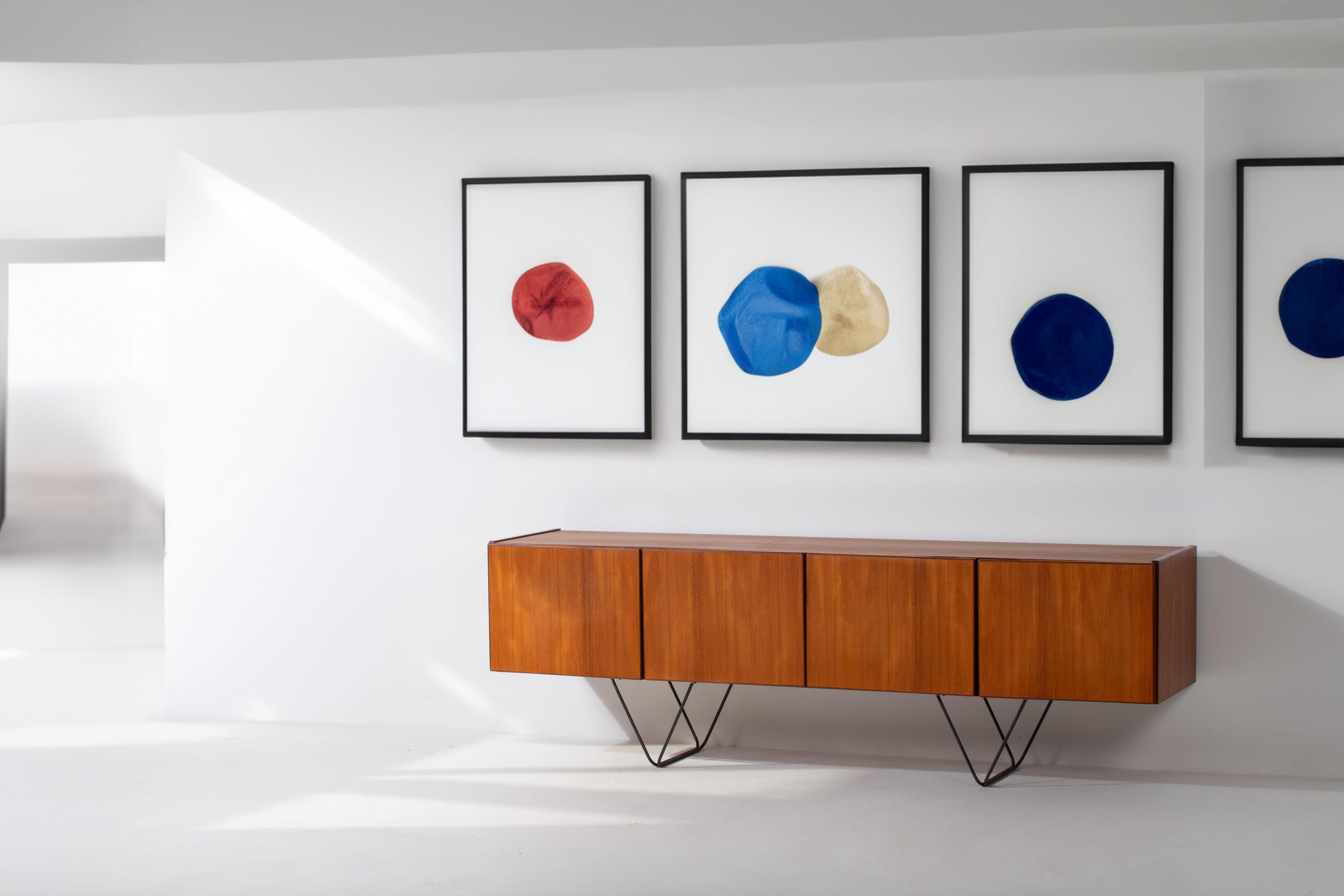 Step into the world of timeless design with our Midcentury Teak Sideboard, a masterpiece that embodies the essence of minimalism while offering exceptional functionality. Crafted with a design philosophy inspired by visionaries Paolo Piva and Harry
