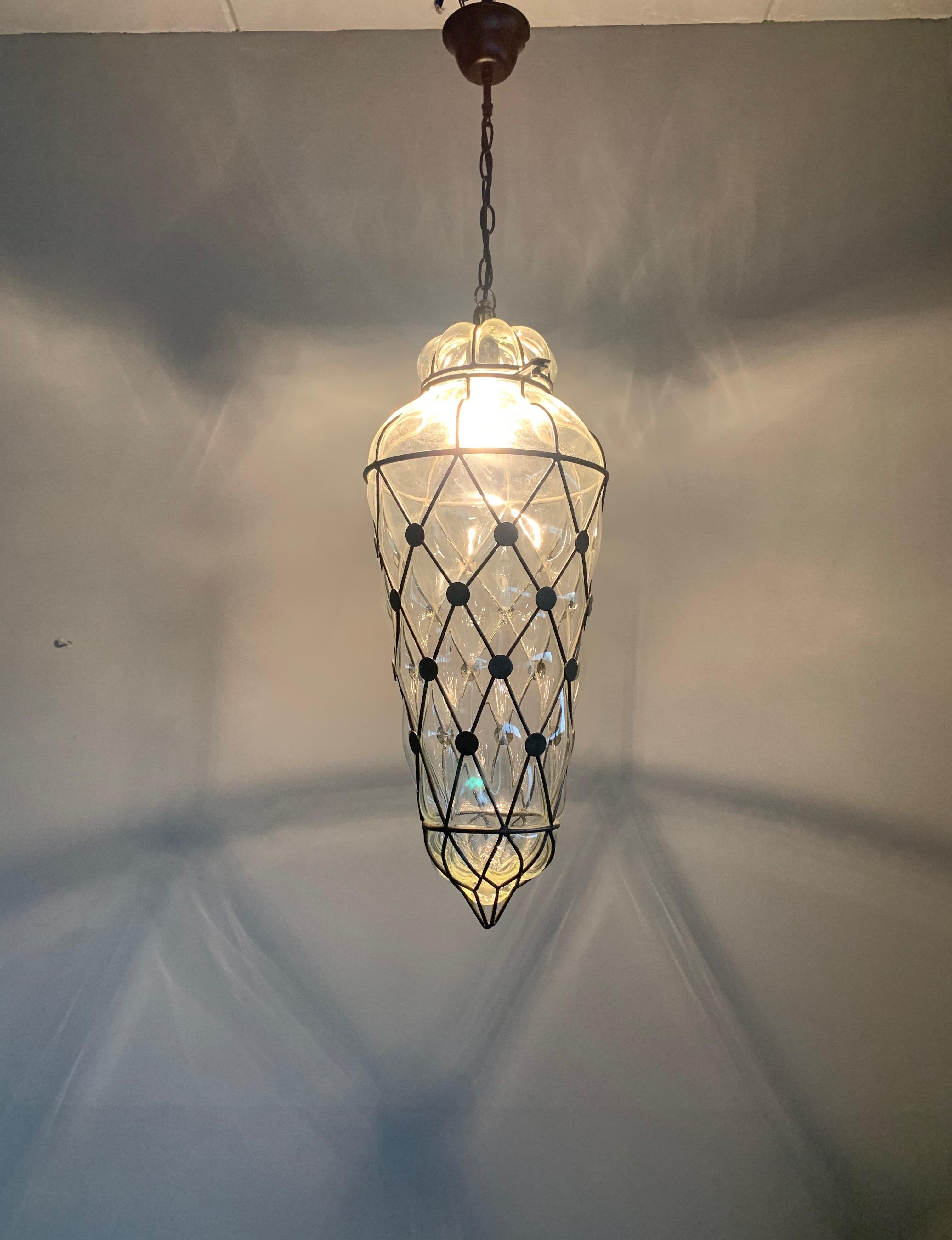 Beautiful and large size fixture with mouthblown glass in a handcrafted metal frame. 

If you are looking for a rare and stylish fixture to grace your home then this handcrafted clear glass specimen could be perfect. We were, again, very happy to
