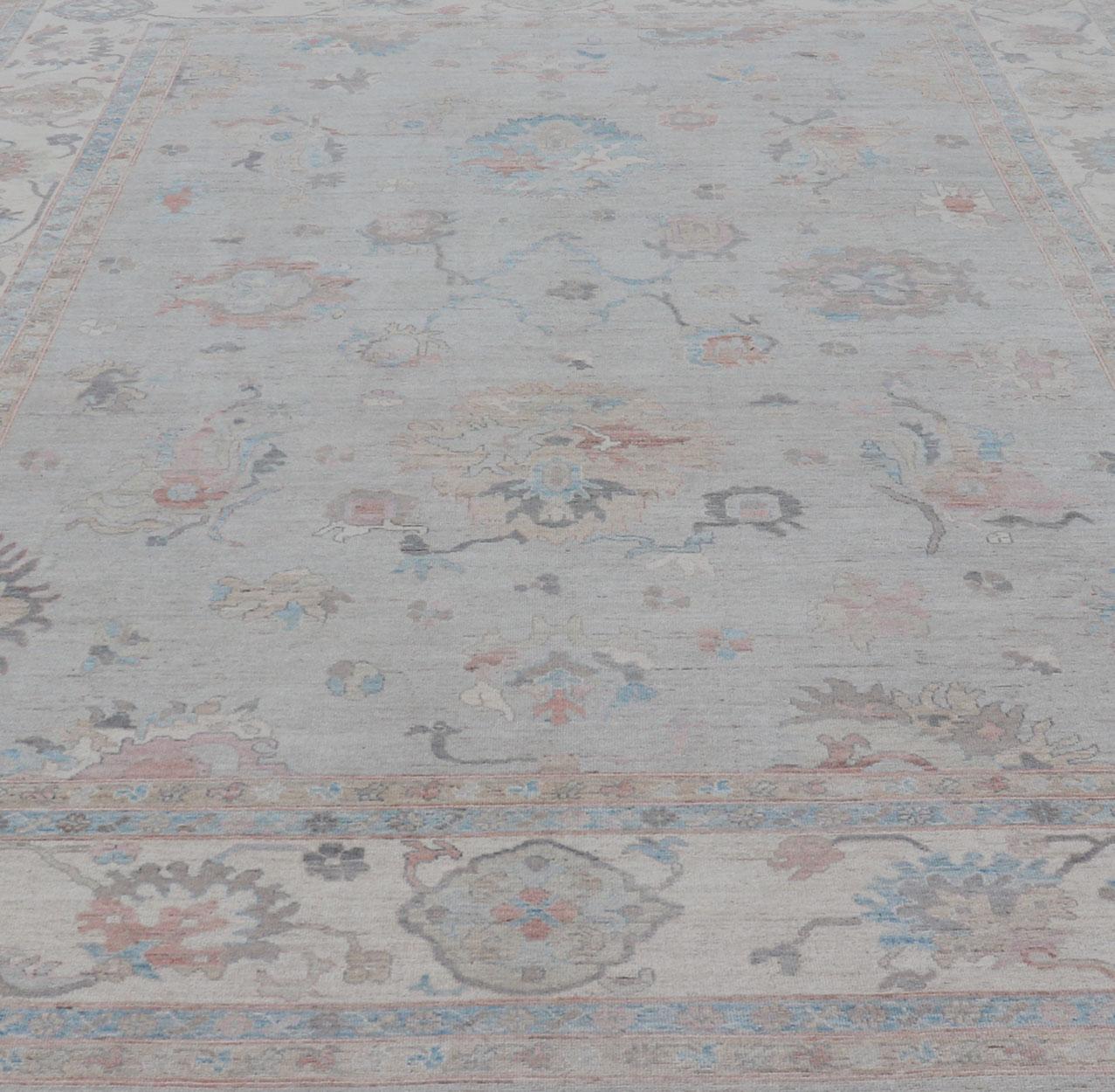 Large Oushak Rug with Floral Motifs & Muted Colorful Tones on Neutral Background For Sale 4