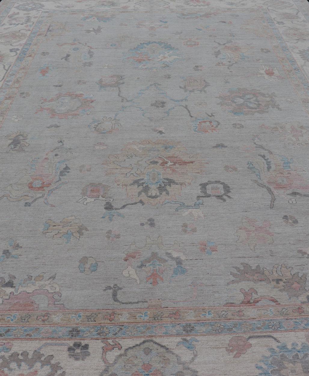 Large Oushak Rug with Floral Motifs & Muted Colorful Tones on Neutral Background For Sale 5