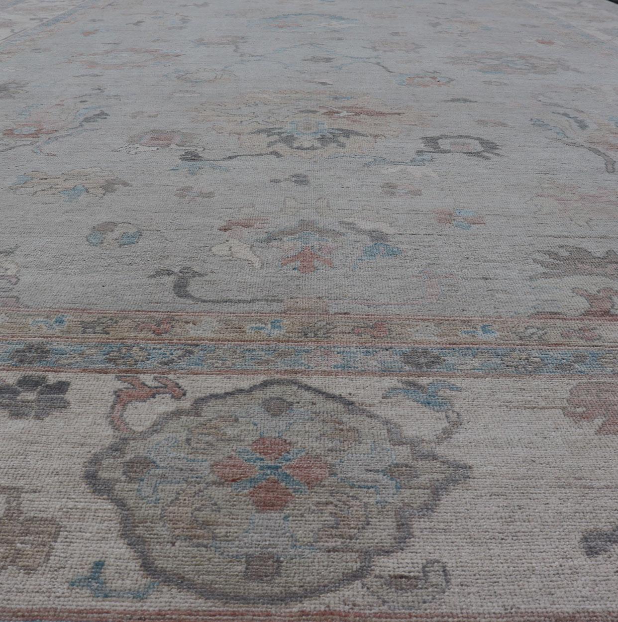 Large Oushak Rug with Floral Motifs & Muted Colorful Tones on Neutral Background For Sale 6
