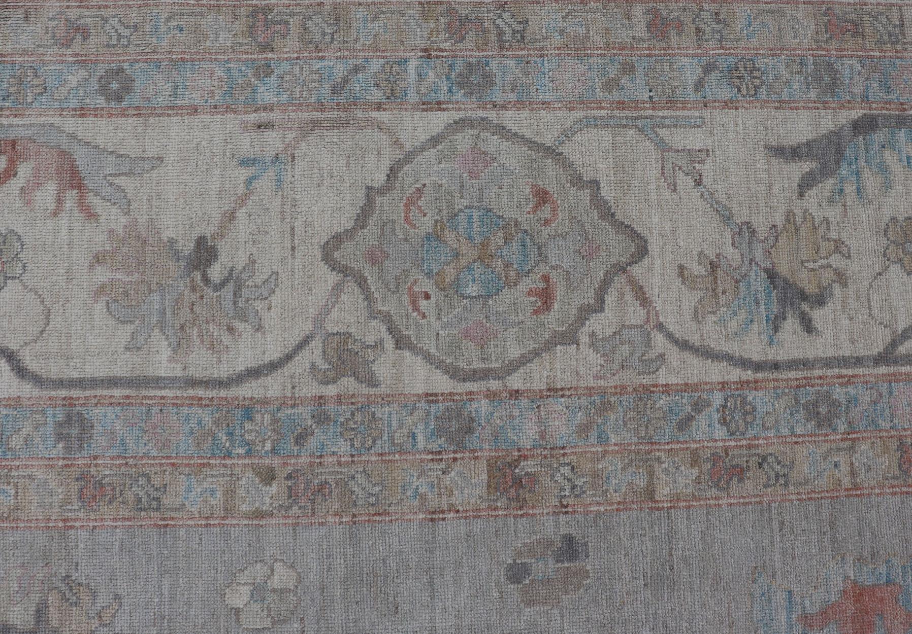 Large Oushak Rug with Floral Motifs & Muted Colorful Tones on Neutral Background and Silver Gray. Keivan Woven Arts; rug AWR-8347 Country of Origin: Afghanistan Type: Oushak Design.

Measures: 12'0 x 17'10 

This large Oushak has a border and