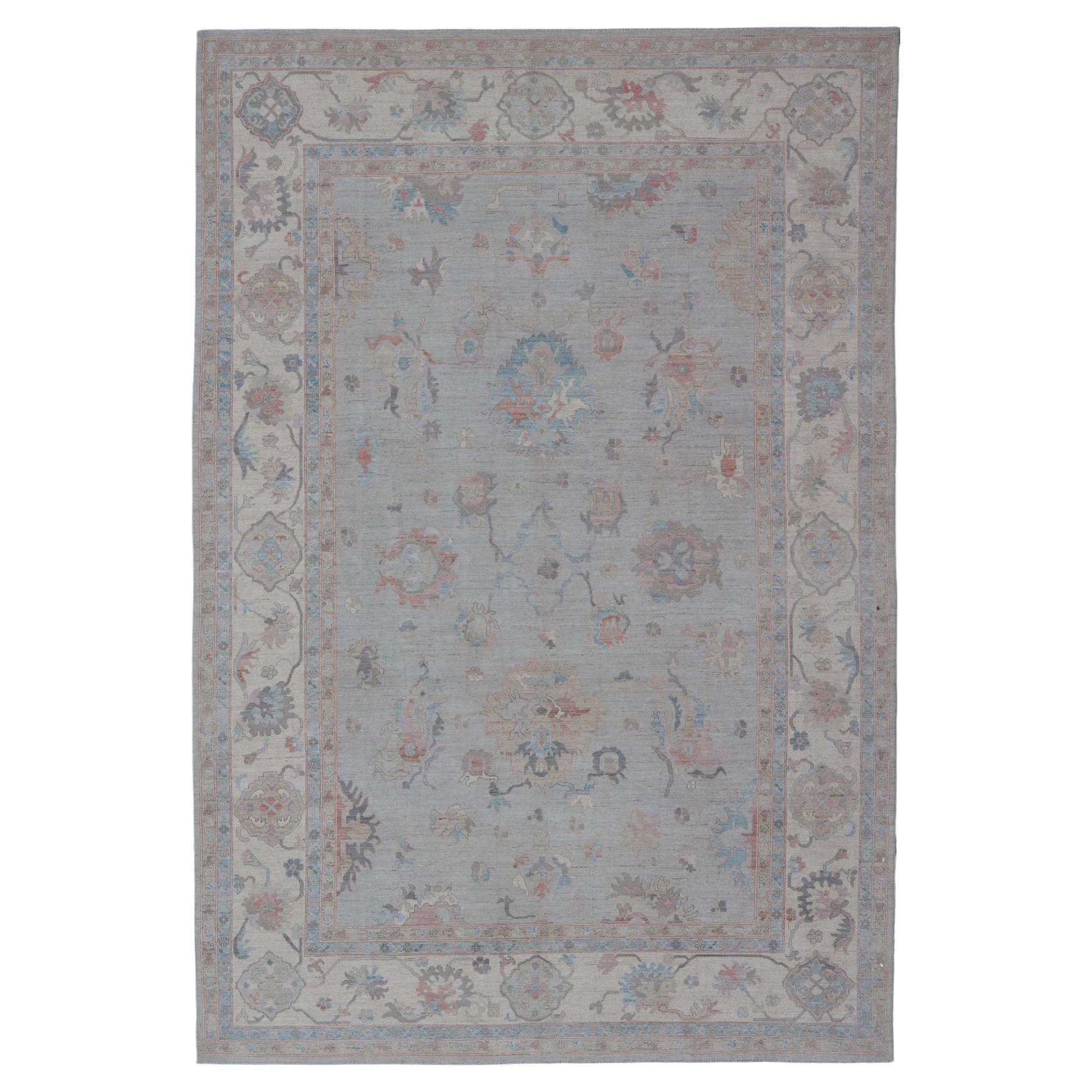 Large Oushak Rug with Floral Motifs & Muted Colorful Tones on Neutral Background For Sale