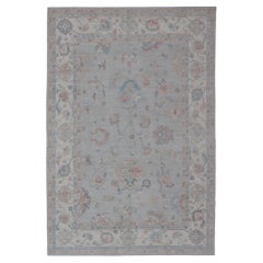 Large Oushak Rug with Floral Motifs & Muted Colorful Tones on Neutral Background