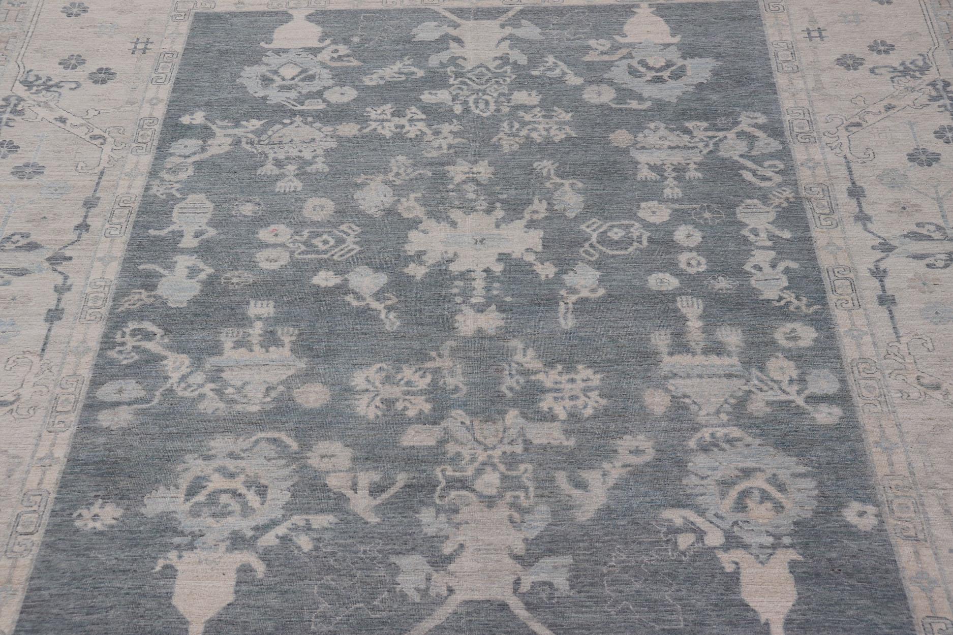 Large Modern sub-geometric oushak rug with muted tones of blue, gray, and cream. Keivan Woven Arts rug AWR-12866 country of origin: Afghanistan Type: Oushak Design: Geometric, mosaic medallion.
Measures: 11'10 x 14'8 
This hand knotted Oushak