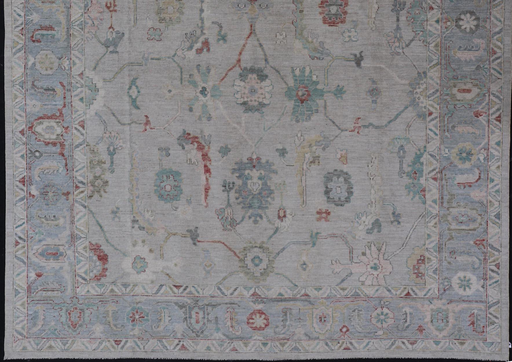 Large Modern Oushak With Floral Design on Light Blue Border With Pop of Colors In New Condition For Sale In Atlanta, GA