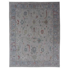 Large Modern Oushak With Floral Design on Light Blue Border With Pop of Colors