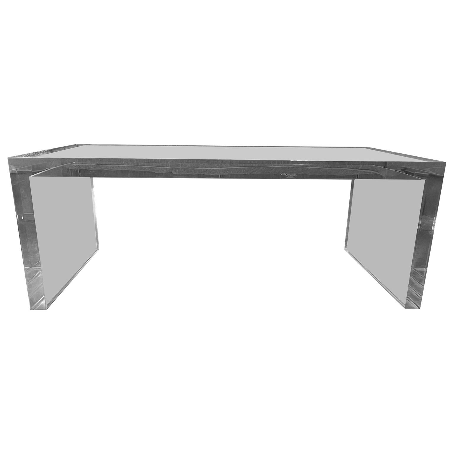 Two inch thick rectangular lucite cocktail table from the early 1980's
This outstanding coffee table is solid and constructed in 2