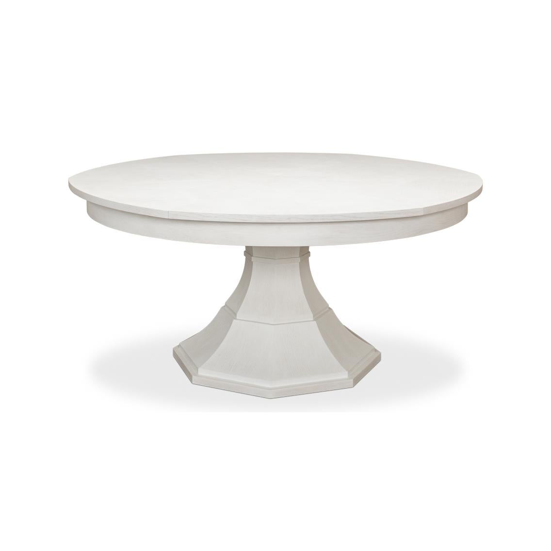 Table de salle à manger Jupe moderne ronde en placage de chêne peint en blanc, avec des feuilles à ranger soi-même, sur un socle en forme de colonne fuselée.
Dimensions ouvertes : 84