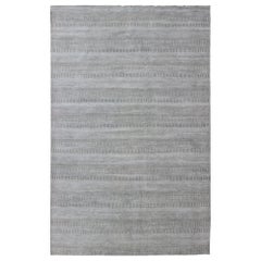 Tappeto moderno di grandi dimensioni con un design di transizione nei toni del grigio e dell'avorio