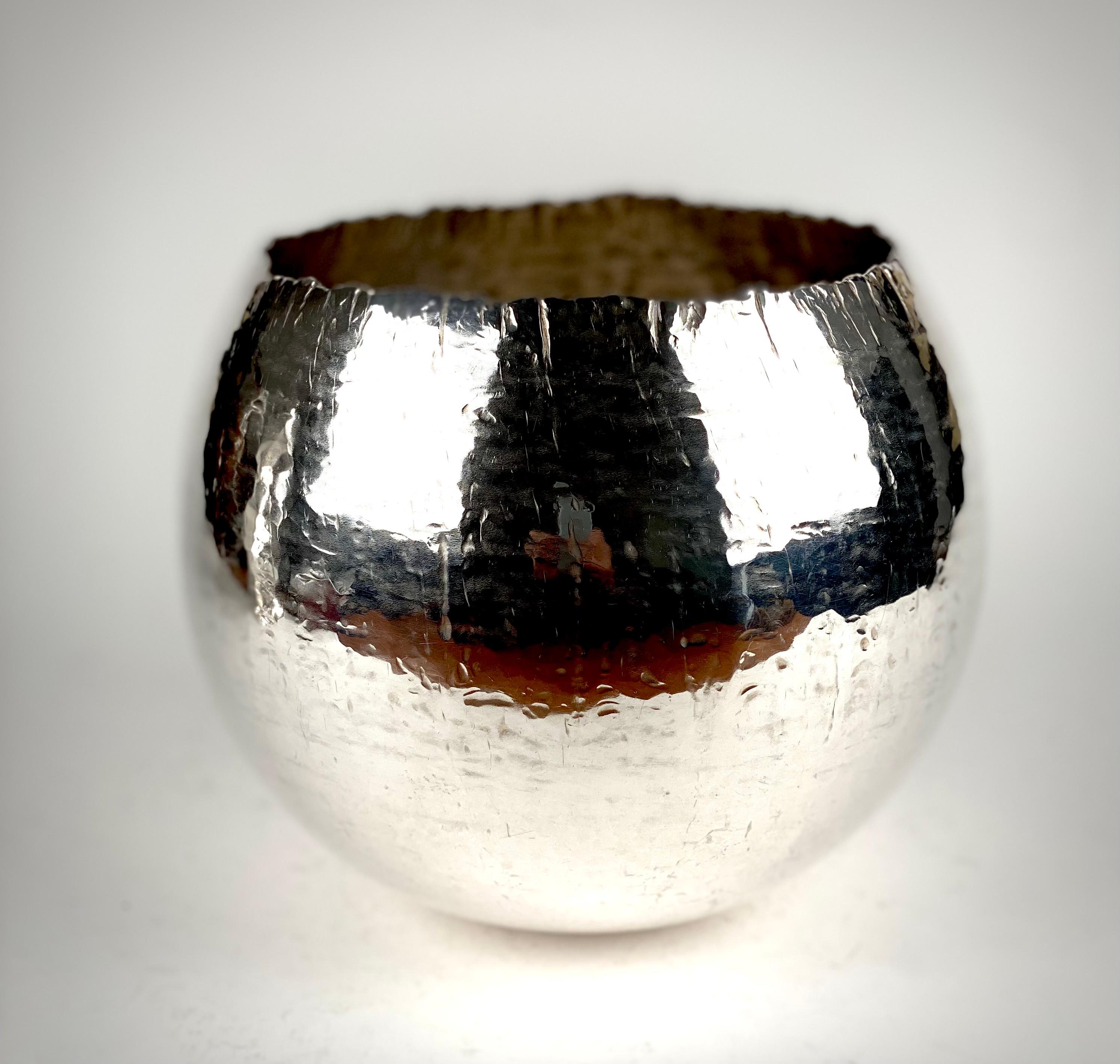 A magnificent bulbous form large Sterling silver bowl with irregular edge, hand hammered 
Designed by Rey Urban (Stockholm 1929 – 2015)
Fully hallmarked and signed to the base 
Weight 971 grams 
Height 16.5 cm 
Width 18cm 
Rey Urban was a Swedish