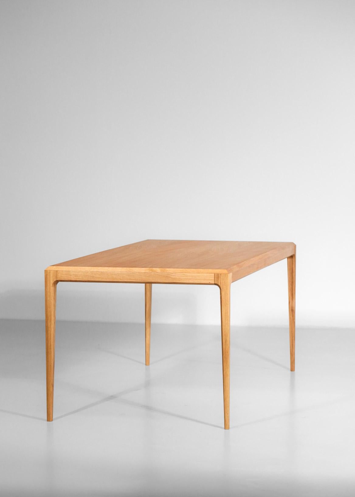 Modern dining table or desk inspired by Danish design. Handcrafted manufacturing in France. The table is made with oak.