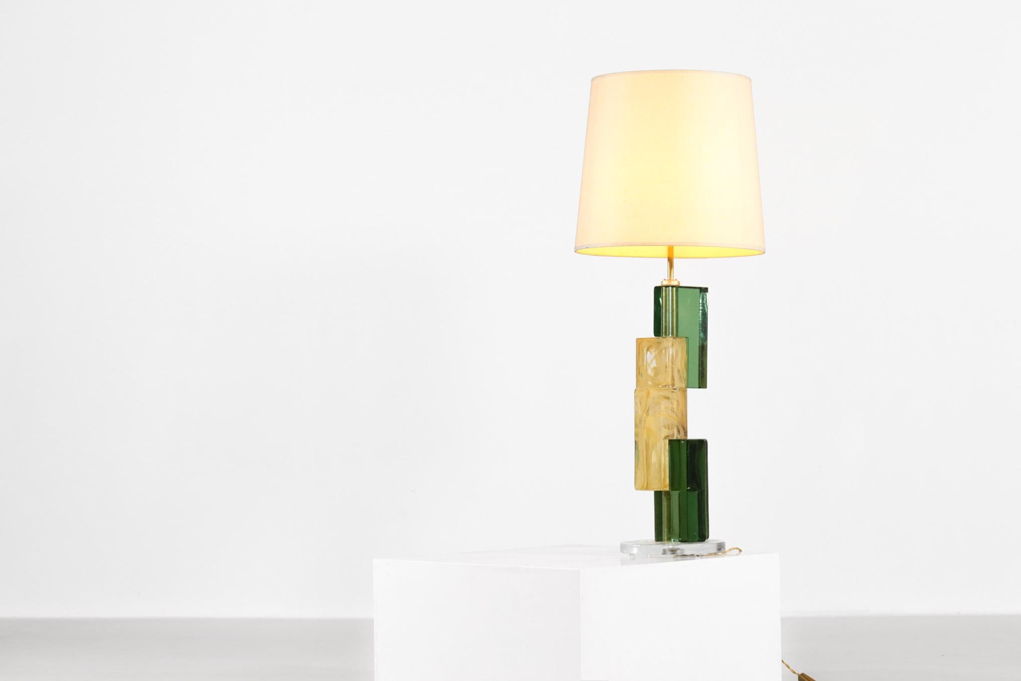 Nice table lamp composed of 4 squares in Murano (green and beige) with a transparent base.