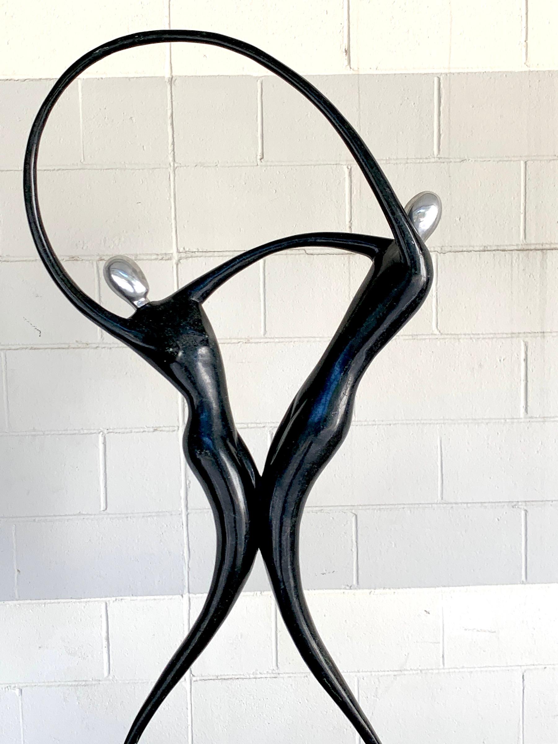 Large Modern Tessellated Stone and Chrome Modern Figural Sculpture In Good Condition For Sale In Atlanta, GA