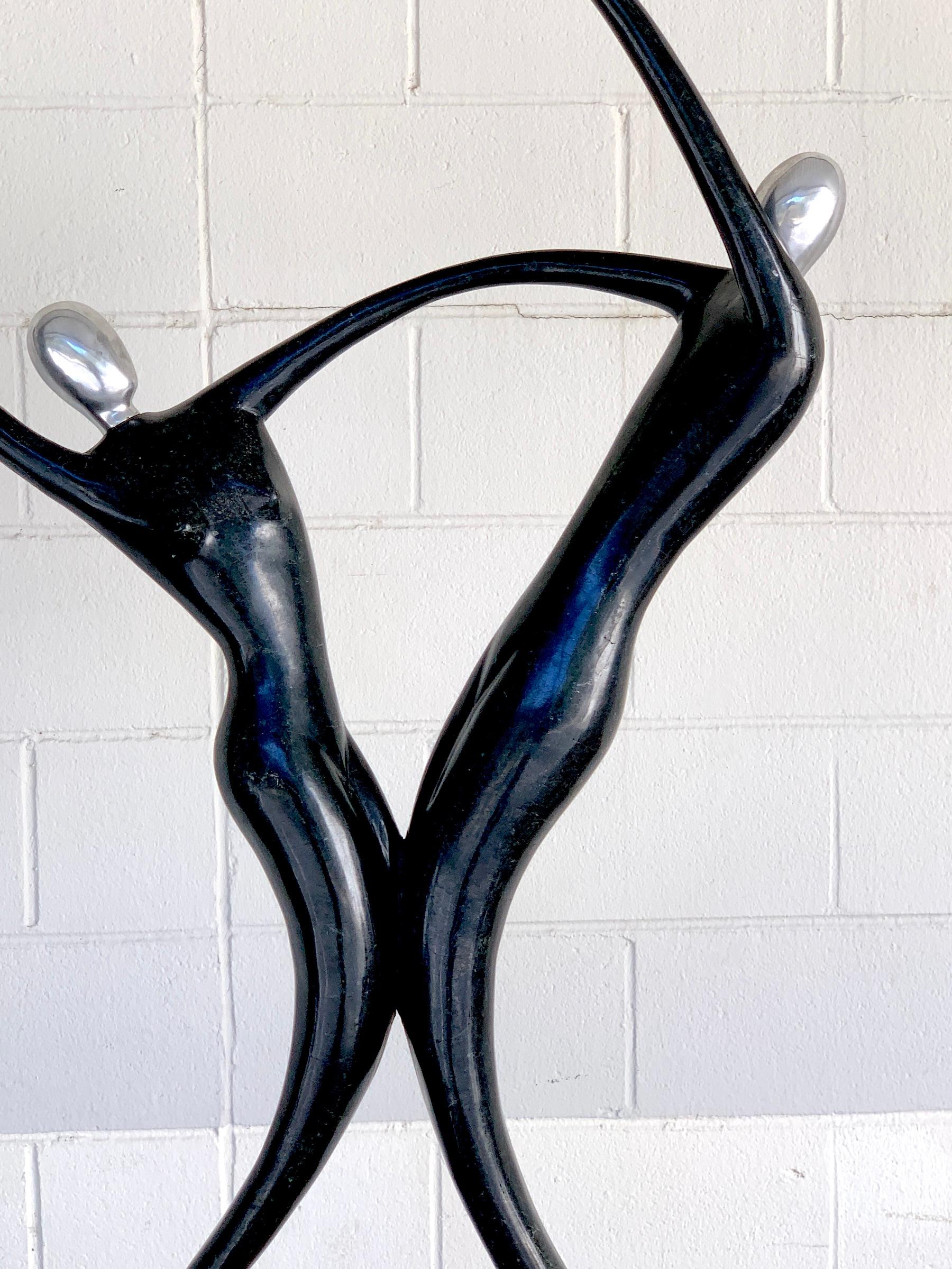 20th Century Large Modern Tessellated Stone and Chrome Modern Figural Sculpture For Sale