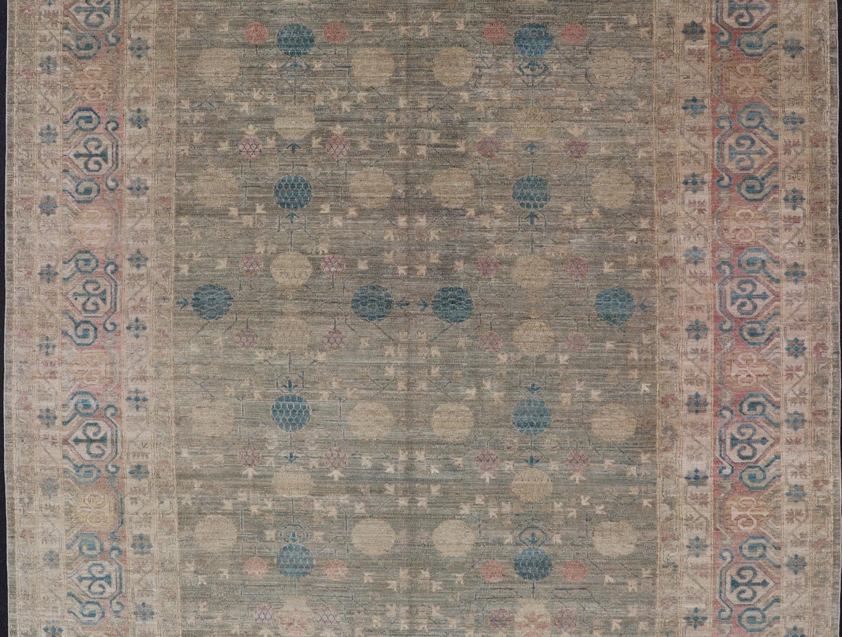 Hand-Knotted Large Modern Tribal Khotan Rug in Shades of Cream, Green, Blue, and Coral For Sale