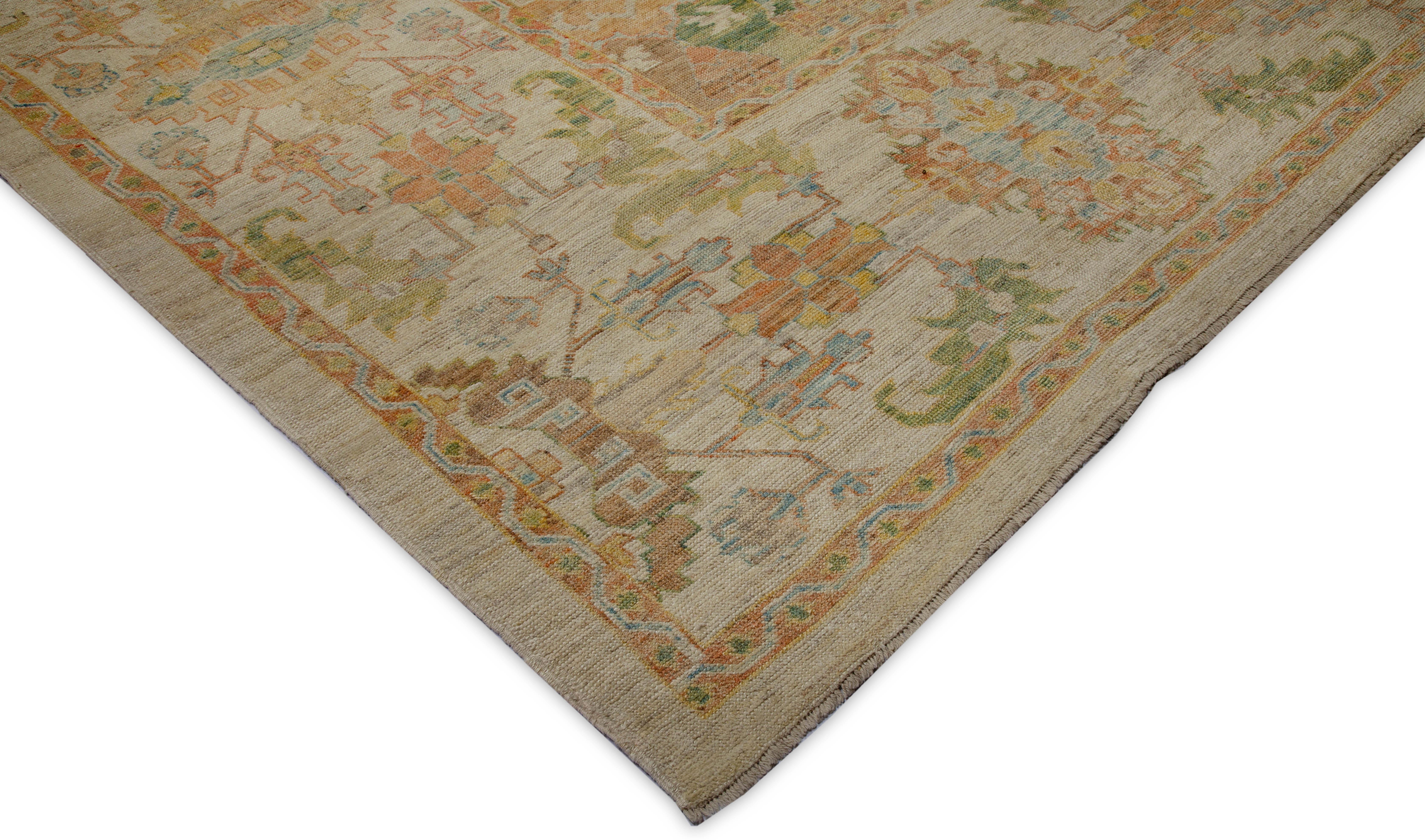 Turkish rug handmade from the finest wool and tinted with 100% organic vegetable dyes that are safe for both humans and pets. It shows a slightly modern twist to the traditional Oushak design featuring a brown field with rows of colorful floral