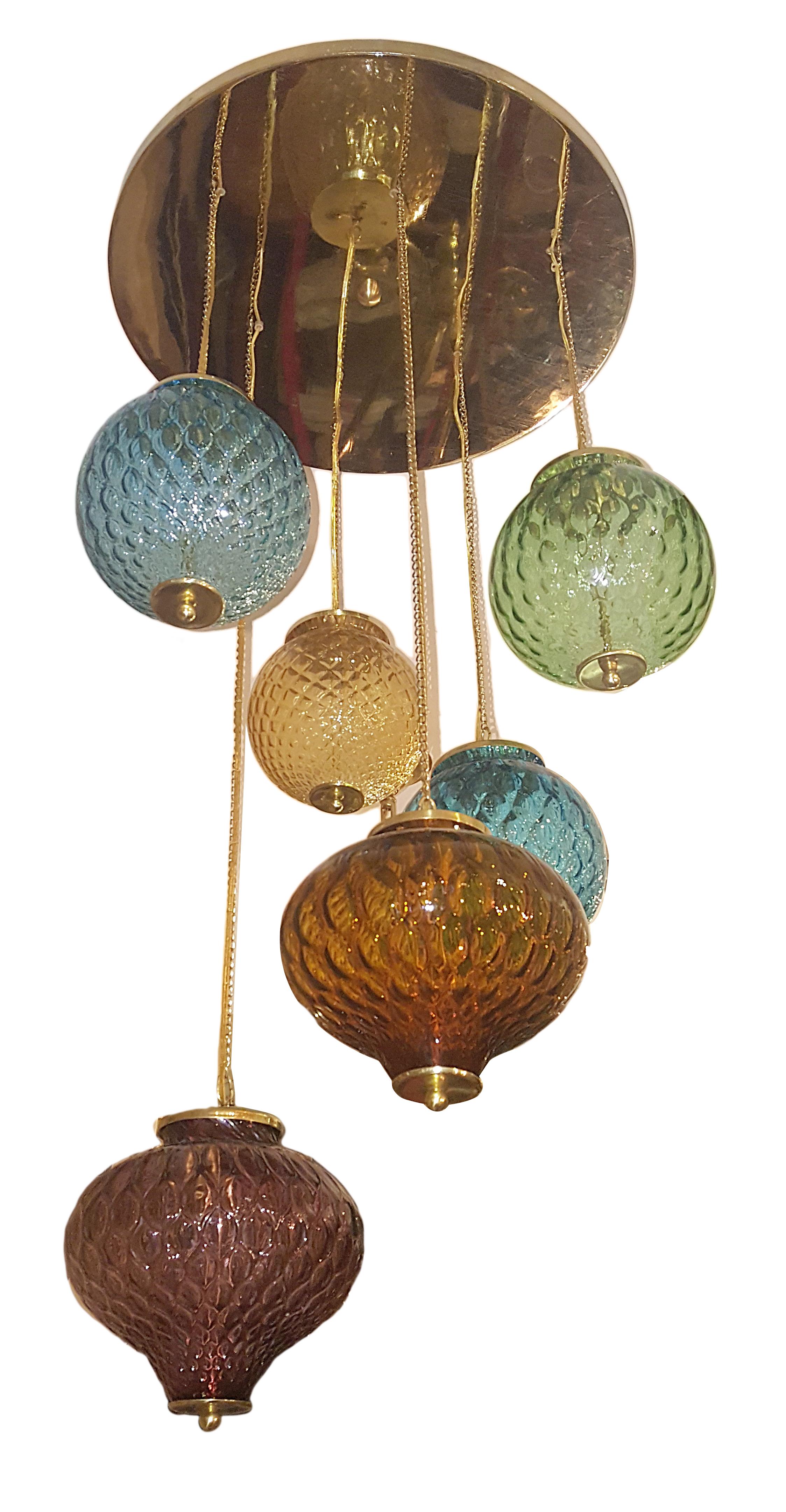 A circa 1960s Italian multi color glass light fixture with six lights.

Measures: W 19 inches, H 41 inches.