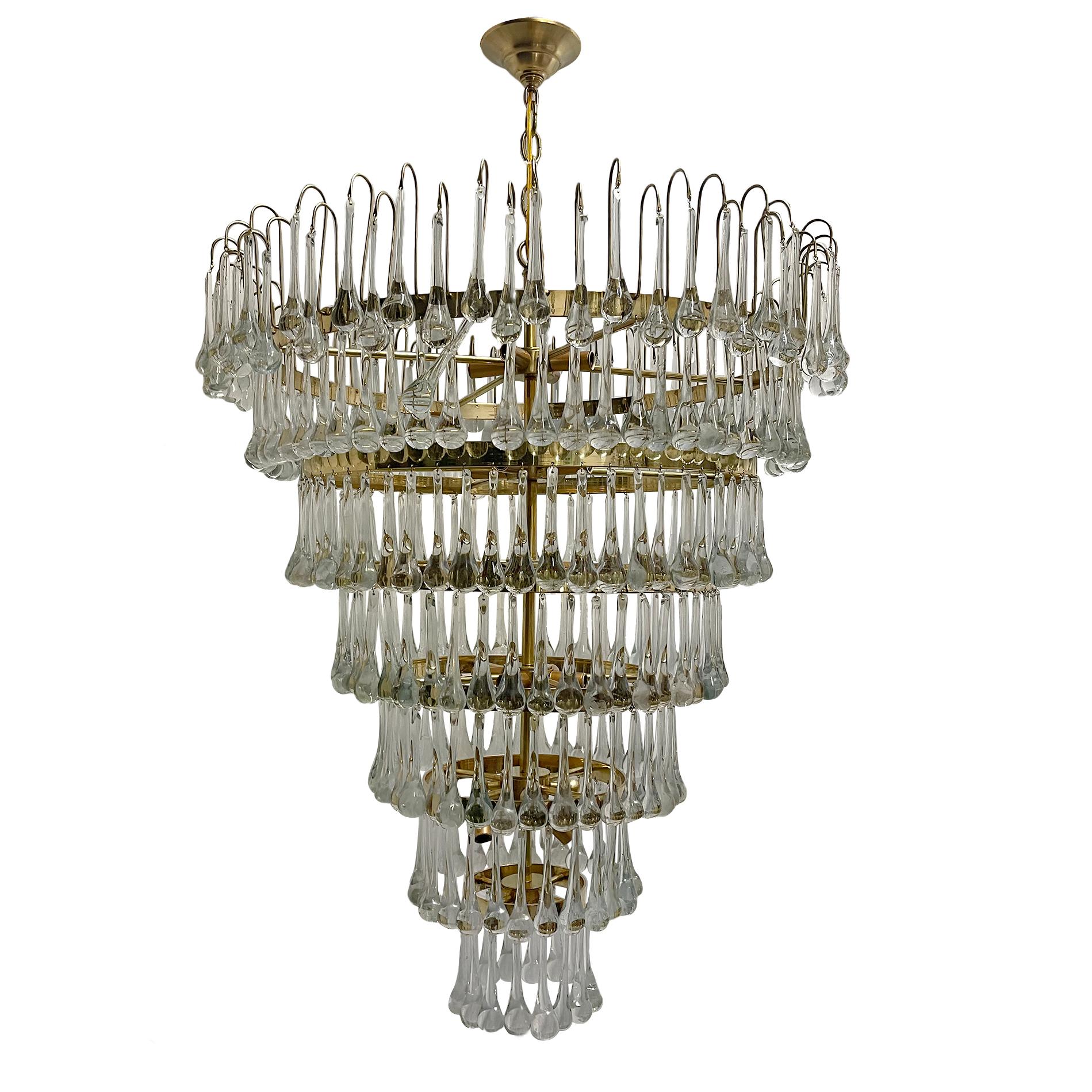 A circa 1960's Italian mid century cascading multi-tiered chandelier with oversized glass drops.

Measurements:
Height 36
