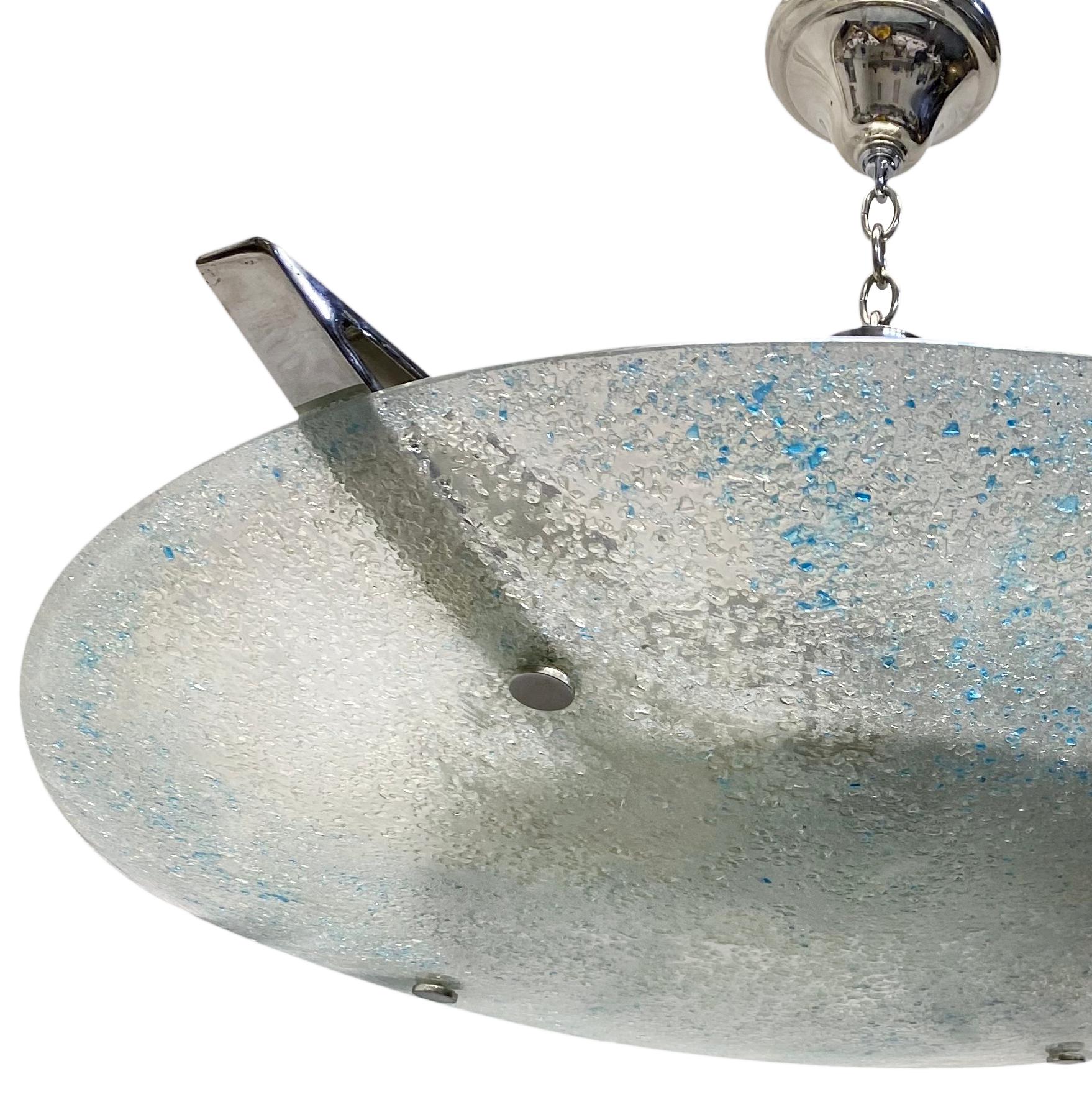 A large circa 1960's Italian molded glass clear and blue light fixture with 12 interior lights and nickel plated body.

Measurements:
Diameter: 40