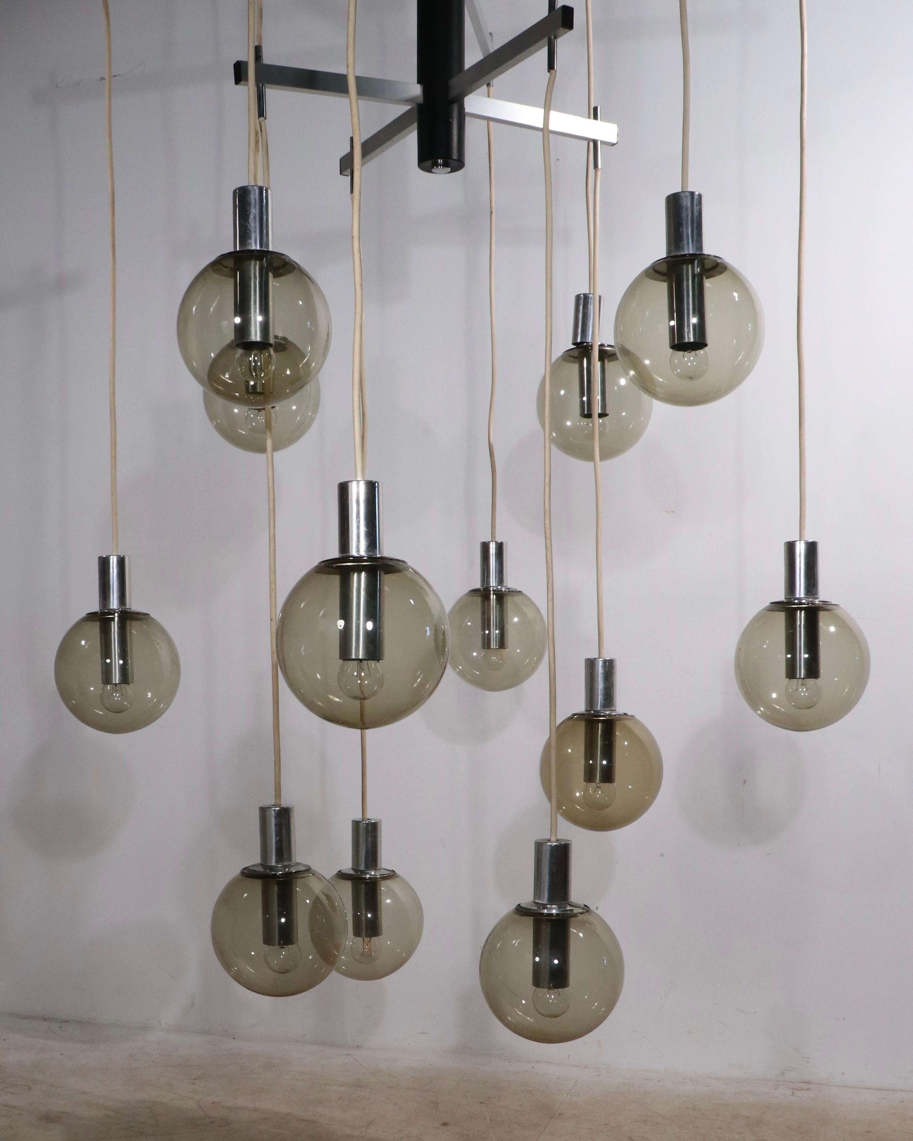 Large Modernist 12 Light Chandelier with Tinted Glass Ball Shades Ca. 1970's In Good Condition For Sale In New York, NY