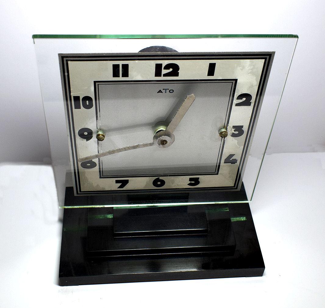 One of the more rare Art Deco clocks is this wonderfully stylish and totally authentic 1930s Art Deco clock by ATO the French clock makers. This clock has a mixtures of materials, mainly bakelite and clear and silvered glass. Very iconic looking