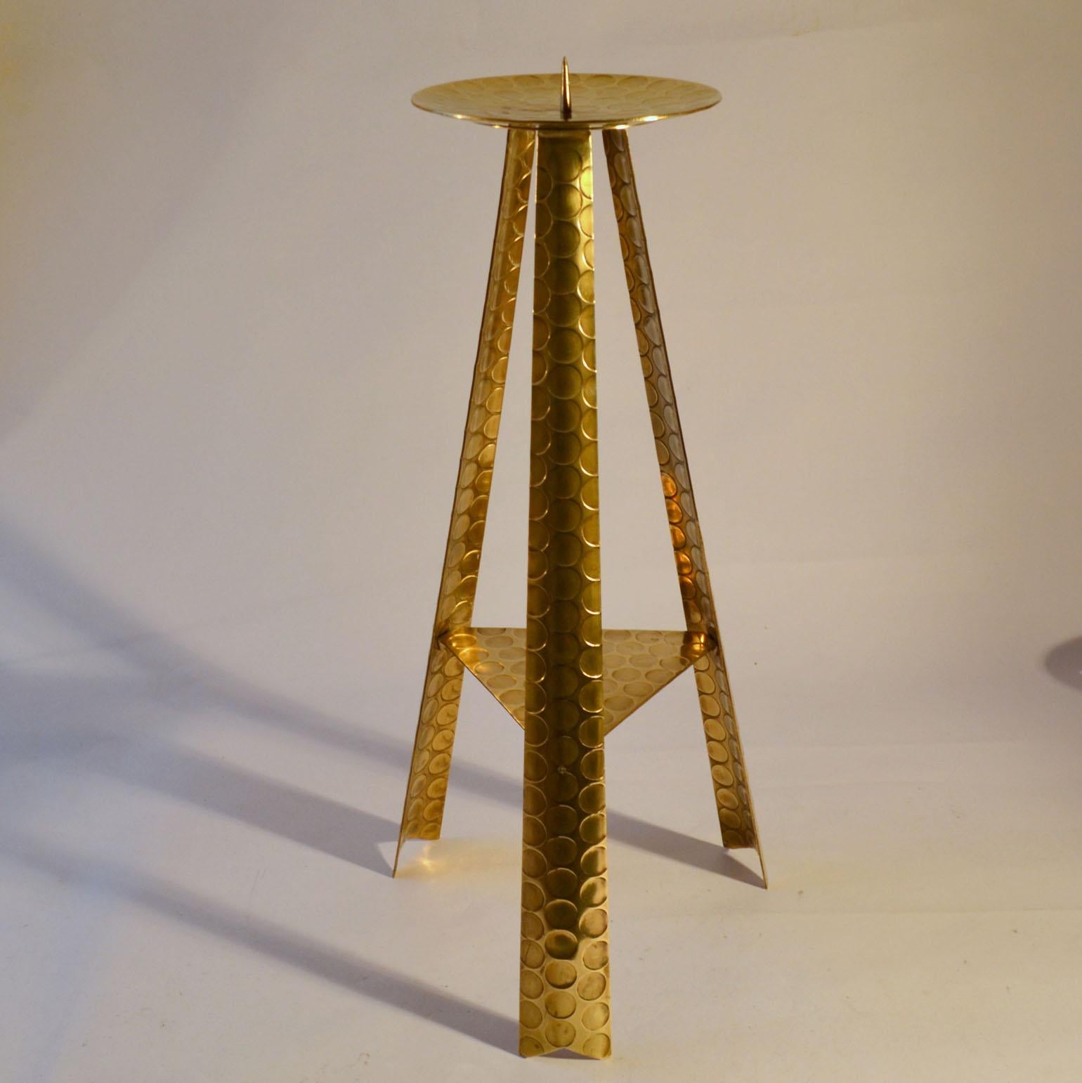Large 1950's floor candle holder handcrafted in brass with stamped circle pattern surface for pillar candles. Possible designed for a church altar. Dimensions are without the candles. 
Dimensions are without the candles.
The candle will be included.