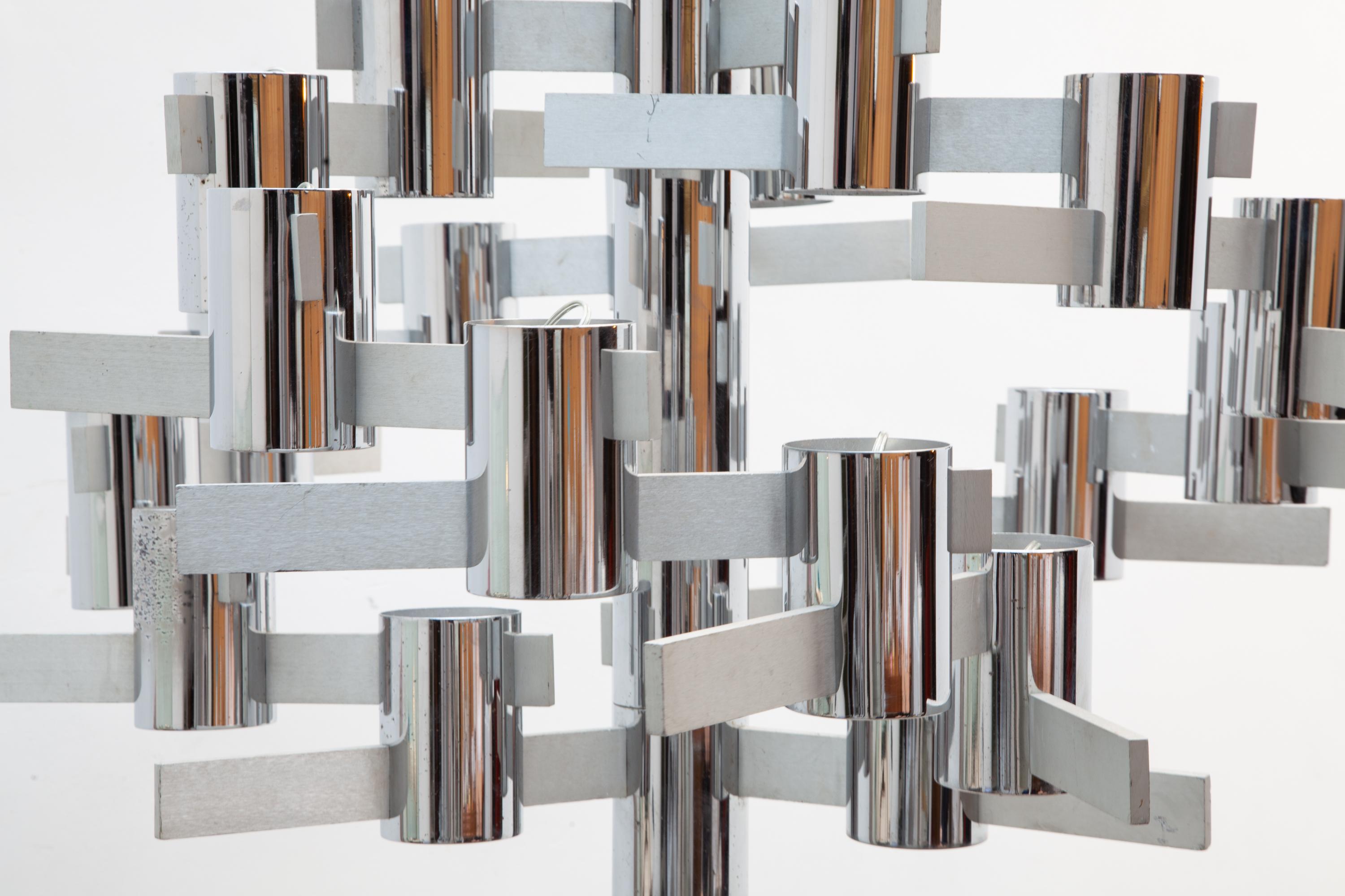 Large rare 1960s chandelier, by Gaetano Sciolari, Italy. Made of brushed chrome and aluminum a series of twenty-two individual lights on geometric steel arms arranged in a spiral formation.This impressive chandelier will make a powerful modernist