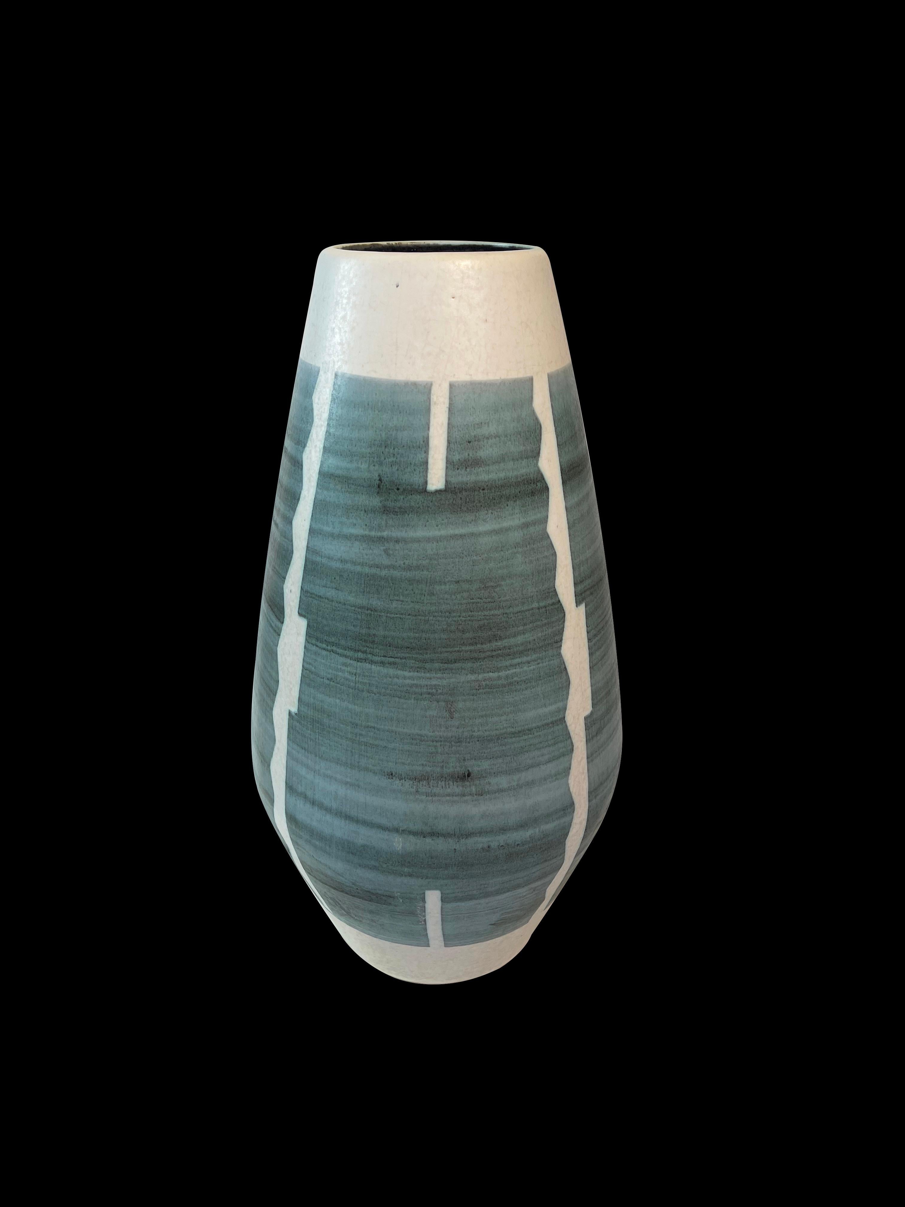 Large impressive mid-century floor vase from ceramic by then West-German pottery makers Fohr.
This vase features modernist patterns inspired by African ethnic designs.
Here on a light beige/grey base colour the greyish blue glaze: obviously spared