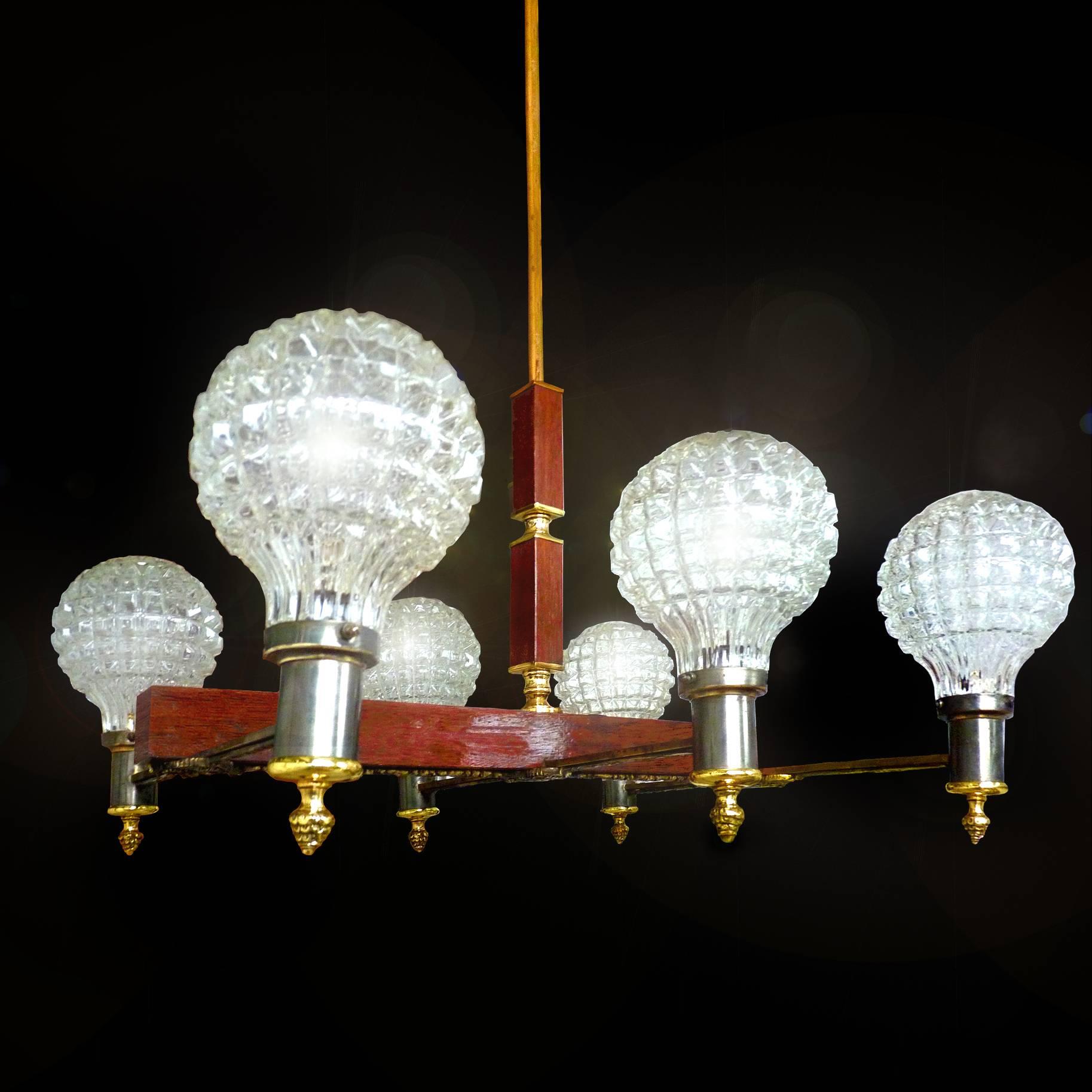 French Art Deco engraved bronze on wood six ice glass shades chandelier, circa 1950.
6-light bulbs E-14, good working condition
Assembly required. Bulbs not included.