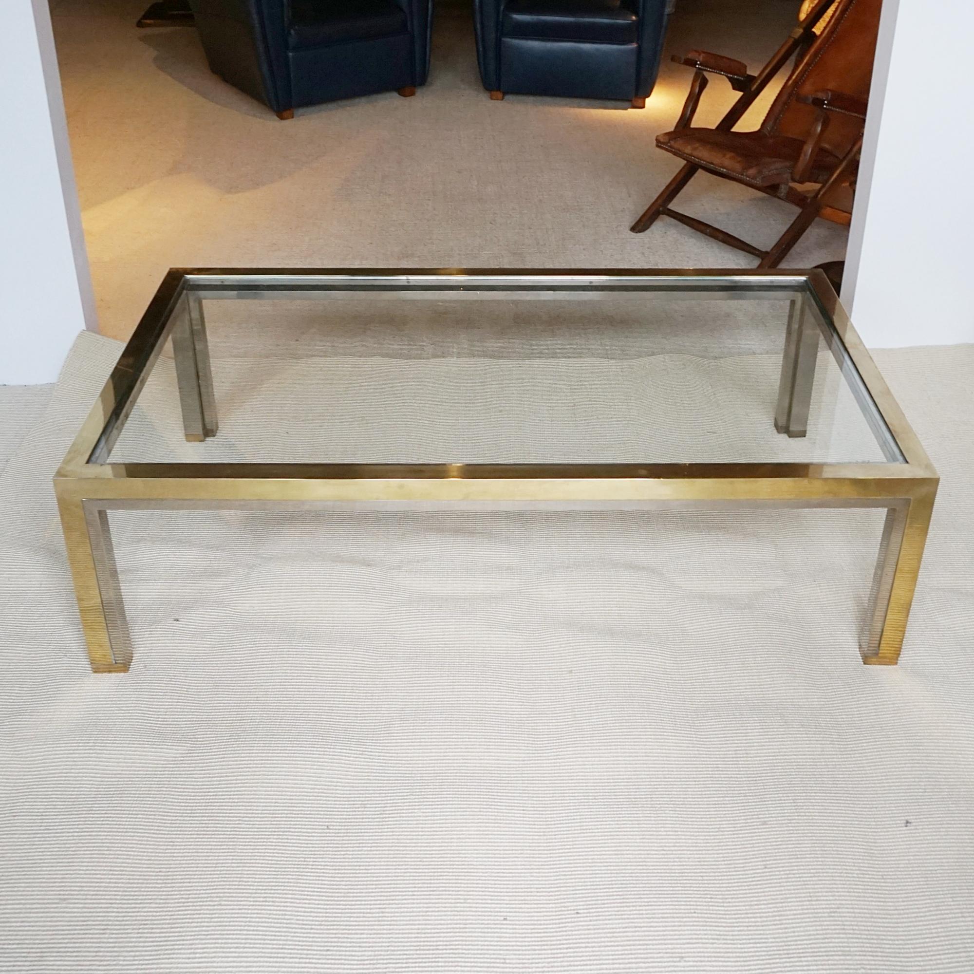 Brass and chrome rectangular frame with inset smoked glass top. 

Dimensions: H 40cm W 140cm D 80cm

Origin: Italian

Date: Circa 1970

Item Number: 1704242

Romeo Rega (1925–1981) was an emblematic figure in the world of Italian design, celebrated