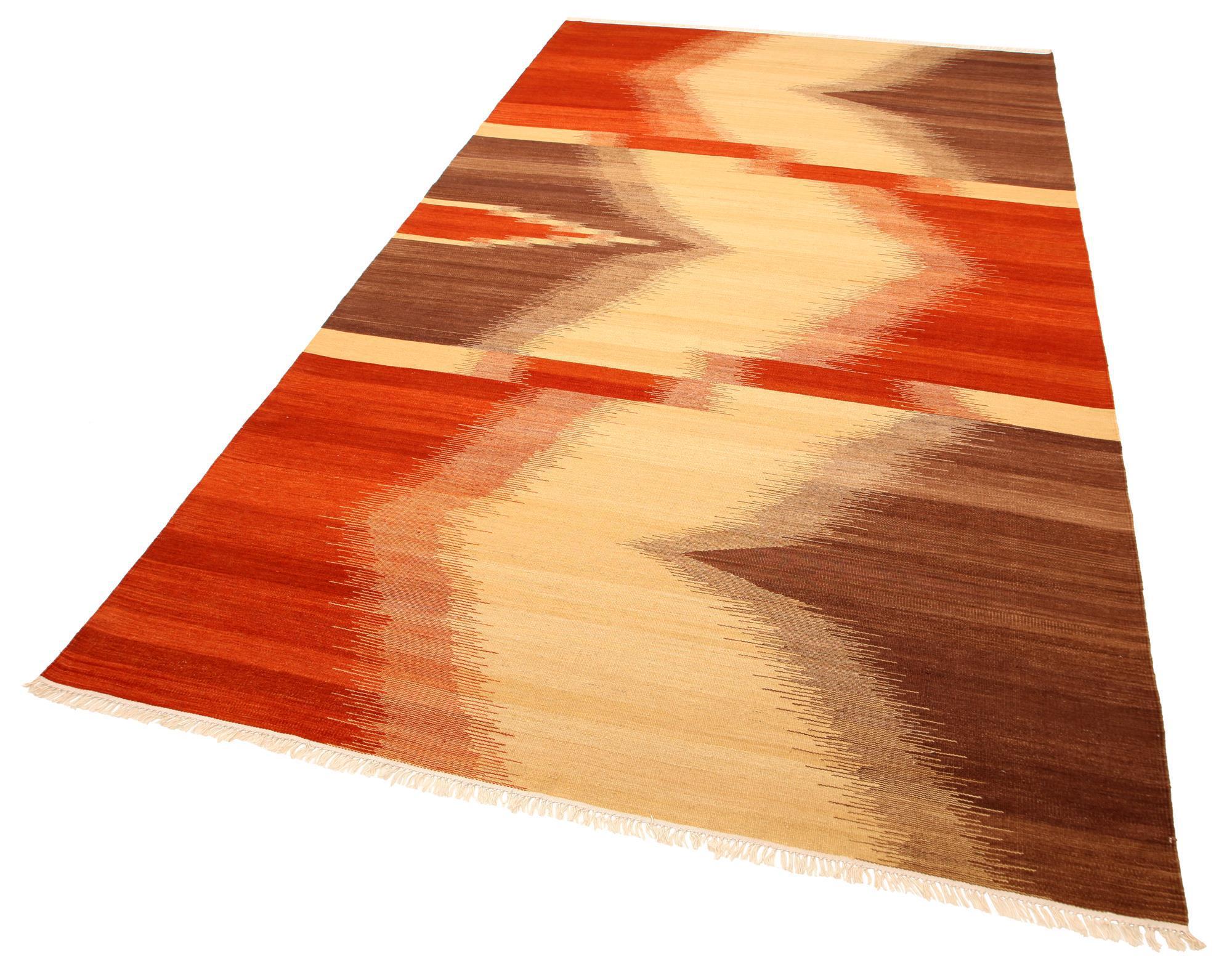 Contemporary cotton wool Kilim with abstract patterns in colors of red, brown and cream.