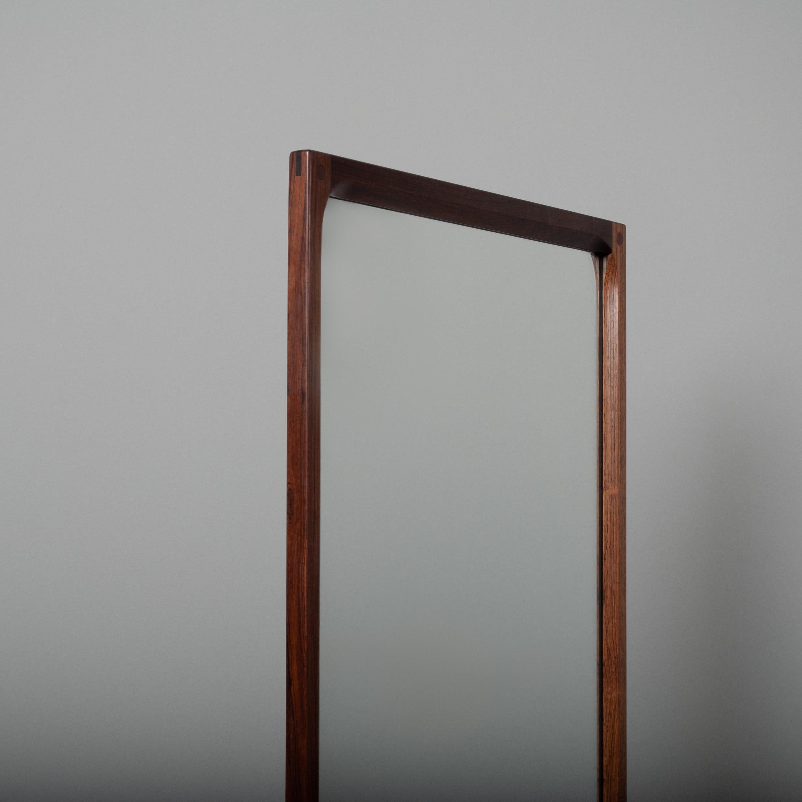 Outstanding mirror designed by Kai Kristiansen for Aksel Kjersgaard. Large version. Produced by Akel Kjersgaard, Odder furniture, Denmark, circa 1960.

