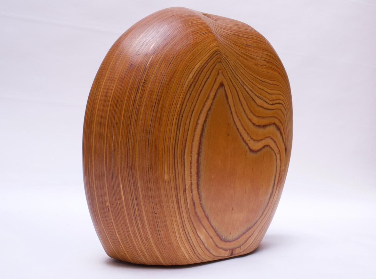 Dense sculptural wooden vase composed of sculpted plywood by New York sculptor, Dick Shanley, circa 1970s-1980s. Very intriguing organic form and large scale (Measures: H 15.75