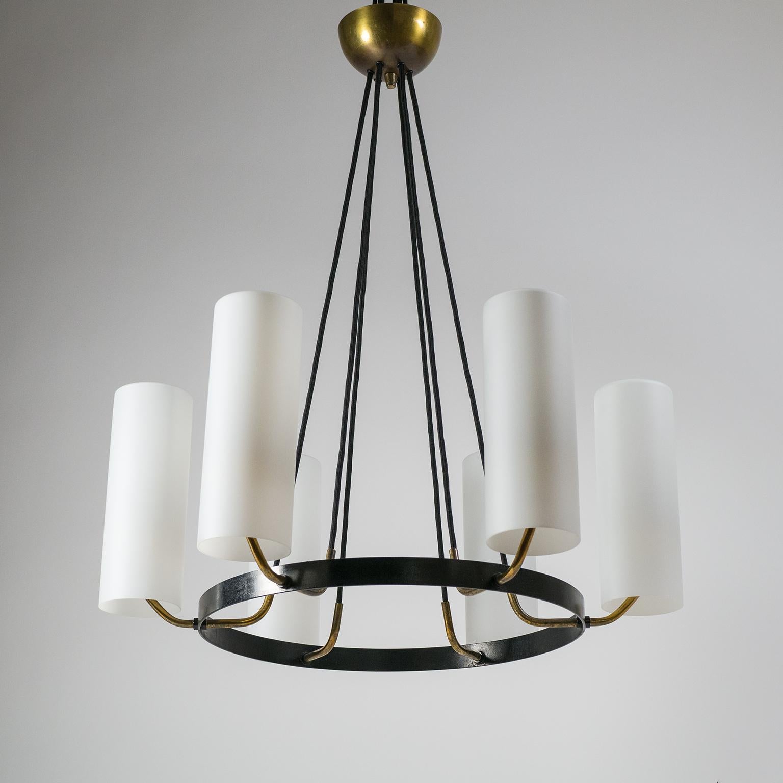 Very fine modernist chandelier from the 1950s. Lovely combination of volume (due to the large glass diffusers) with a very light-weight Minimalist design. Six large cased satin glass diffusers appear to be floating atop brass arms attached to a