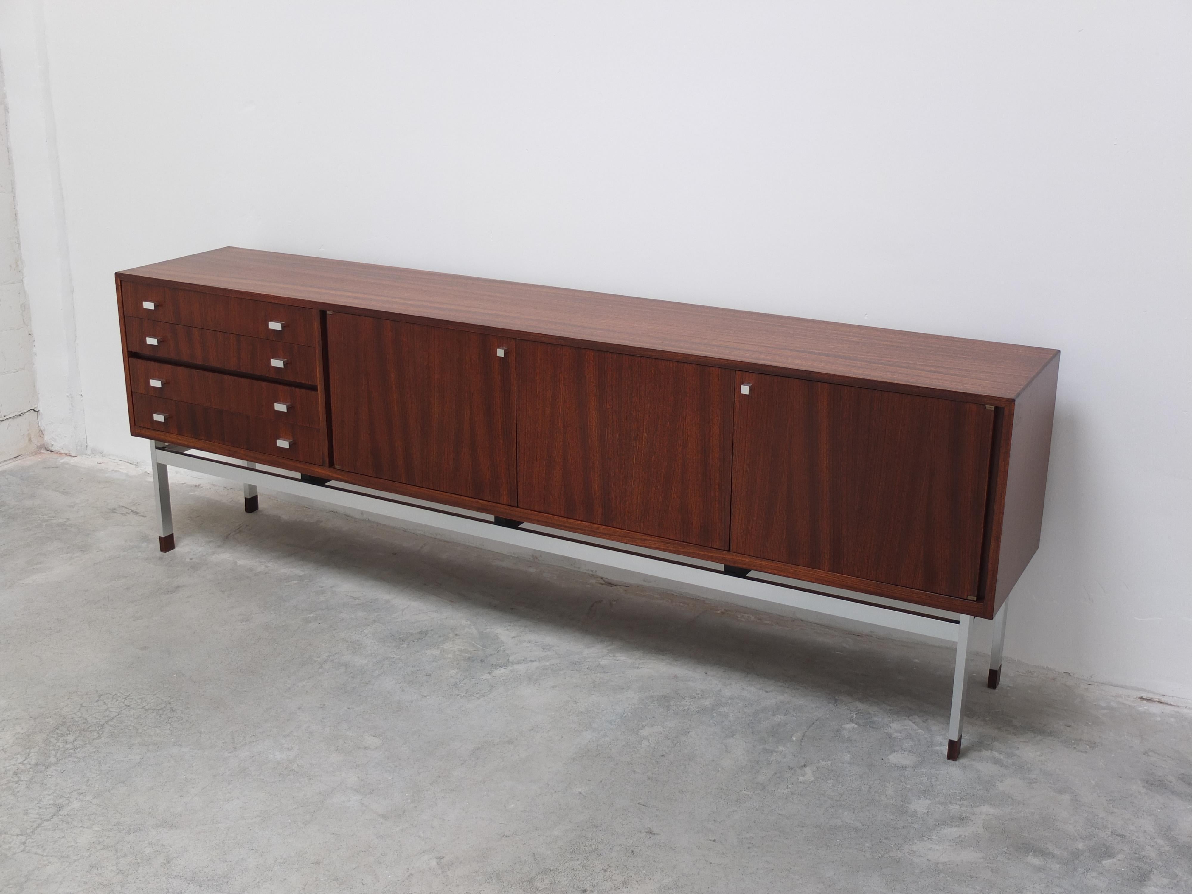 Large sideboard in rosewood designed by Oswald Vermaercke for V-Form during the 1960s. This design is not common and has a very modernist feel to it thanks to the subtle use of metal whereas most other models by Vermaercke are all wood. Another