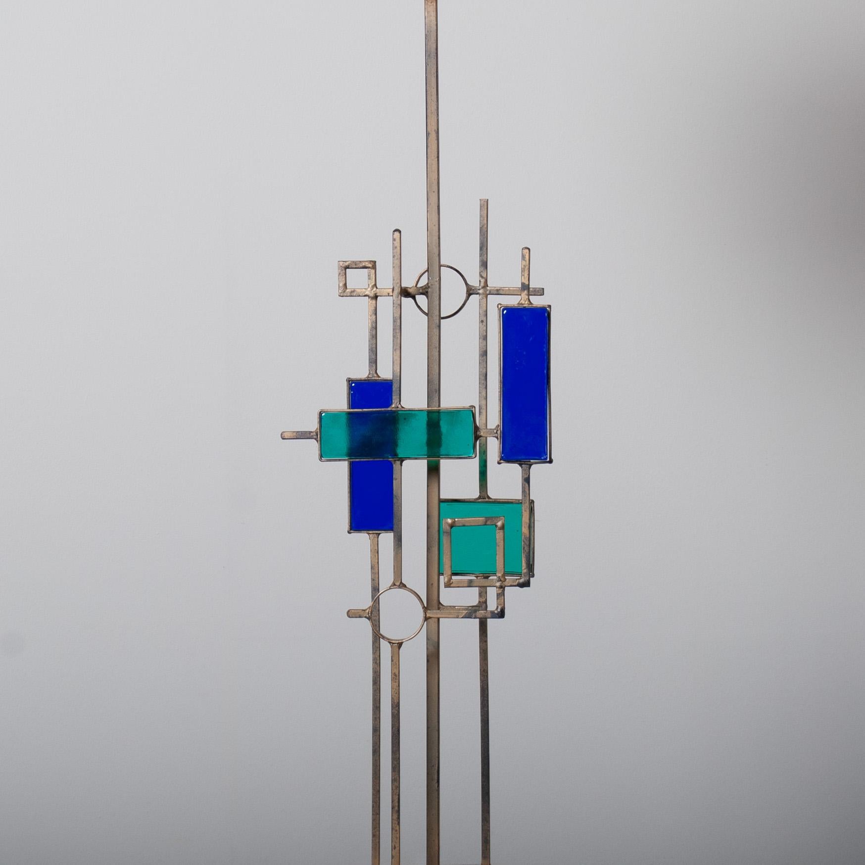 A tall modernist table lamp by renowned designer and manufacturer Svend Aage Holm Sørensen. Produced in Denmark circa 1960. 
Wonderful use of thick art glass amongst the geometrically shaped steel structure. 
The rectangular shade is perfectly