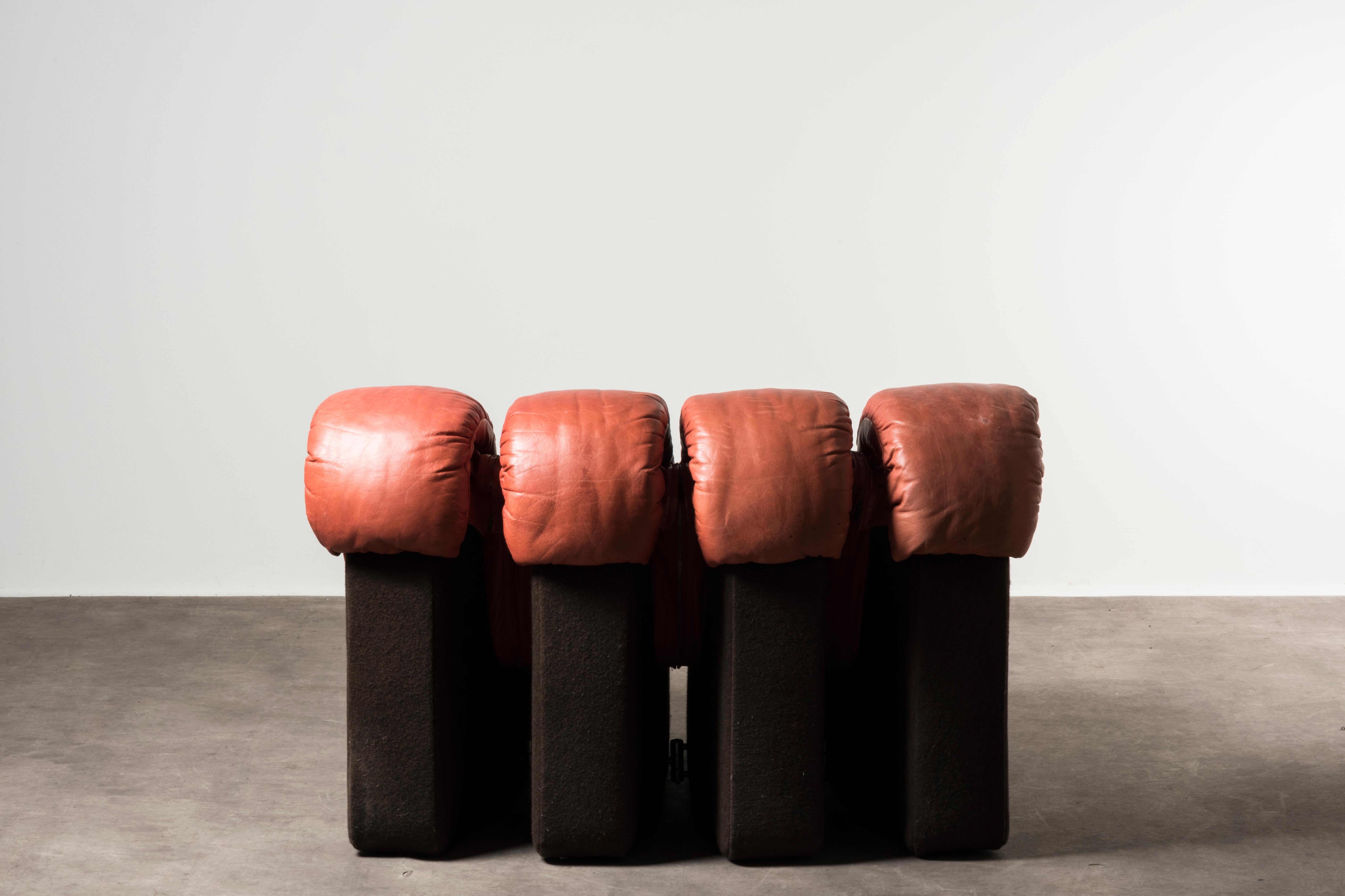 Large modular sofa (24 modules) by Ueli Berger, Eleonore Peduzzi Riva e Klaus Vogt. Italy, 1972. Manufactured by De Sede. Wood, leather. Measures: 100 x 600 x H 73 cm, each module: 100 x 25 x H 73 cm 39.3 x 236.2 x H 28.7 in - each module: 39.3 x
