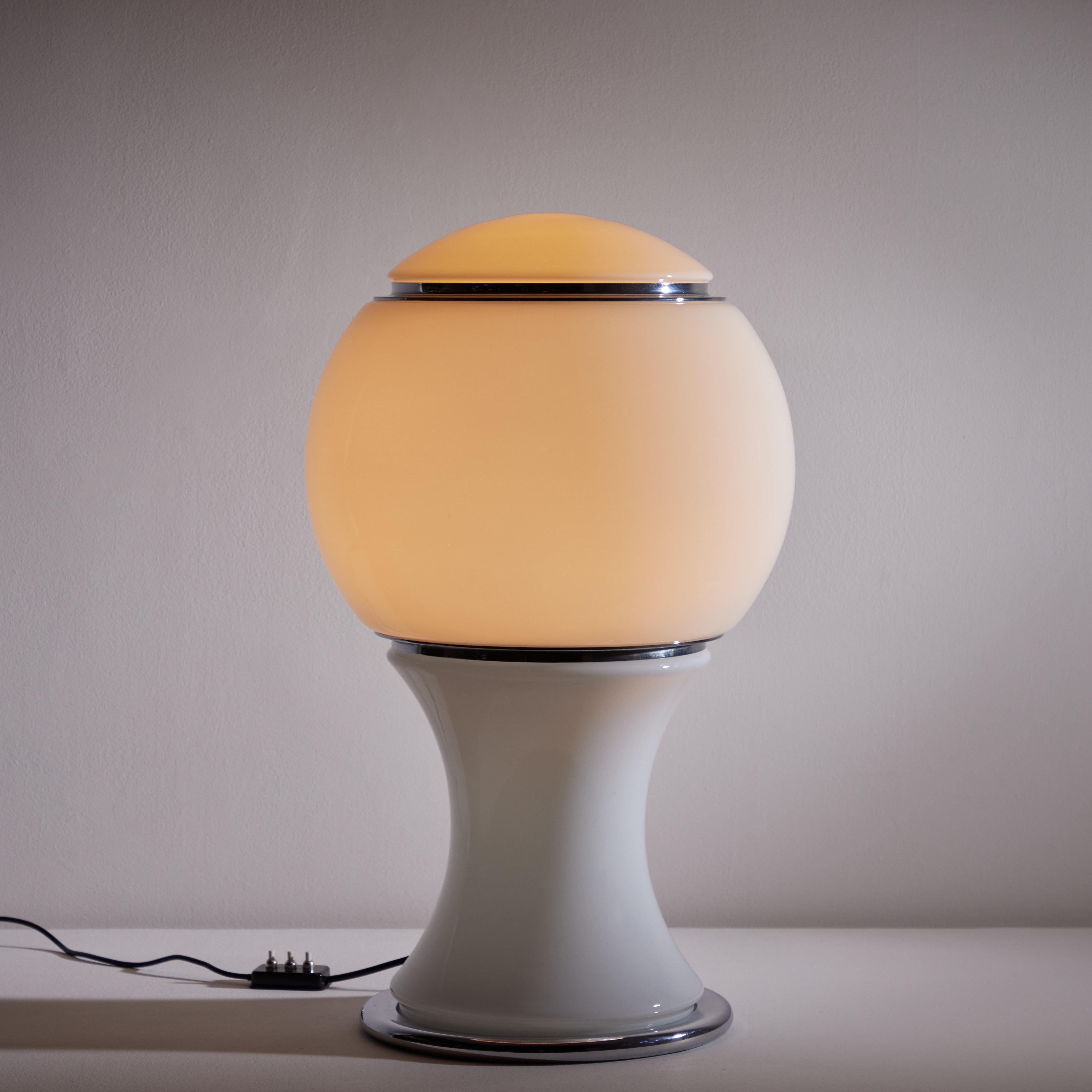 Large 'Mongolfiera' table lamp by Gianni Celada for Fontana Arte. Designed and manufactured in 1966 approximately. Shade is composed of three sections of opaline glass with chrome detailing. Each glass section has its own illumination. Cord switch