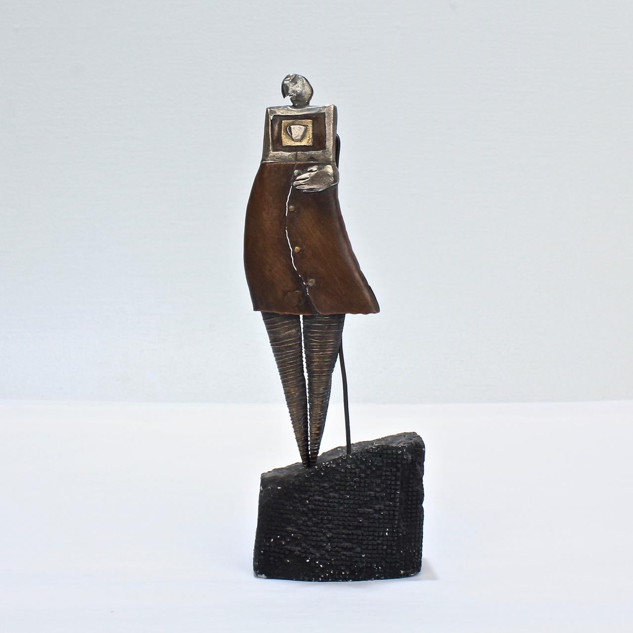 A wonderful mixed metals Steampunk brooch from the jewelry maker and sculptor, Monika Tinker.

The body constructed in copper with silver and gold inlay and the legs in silver. 

Complete with its original artist made stand.

Faintly signed on the