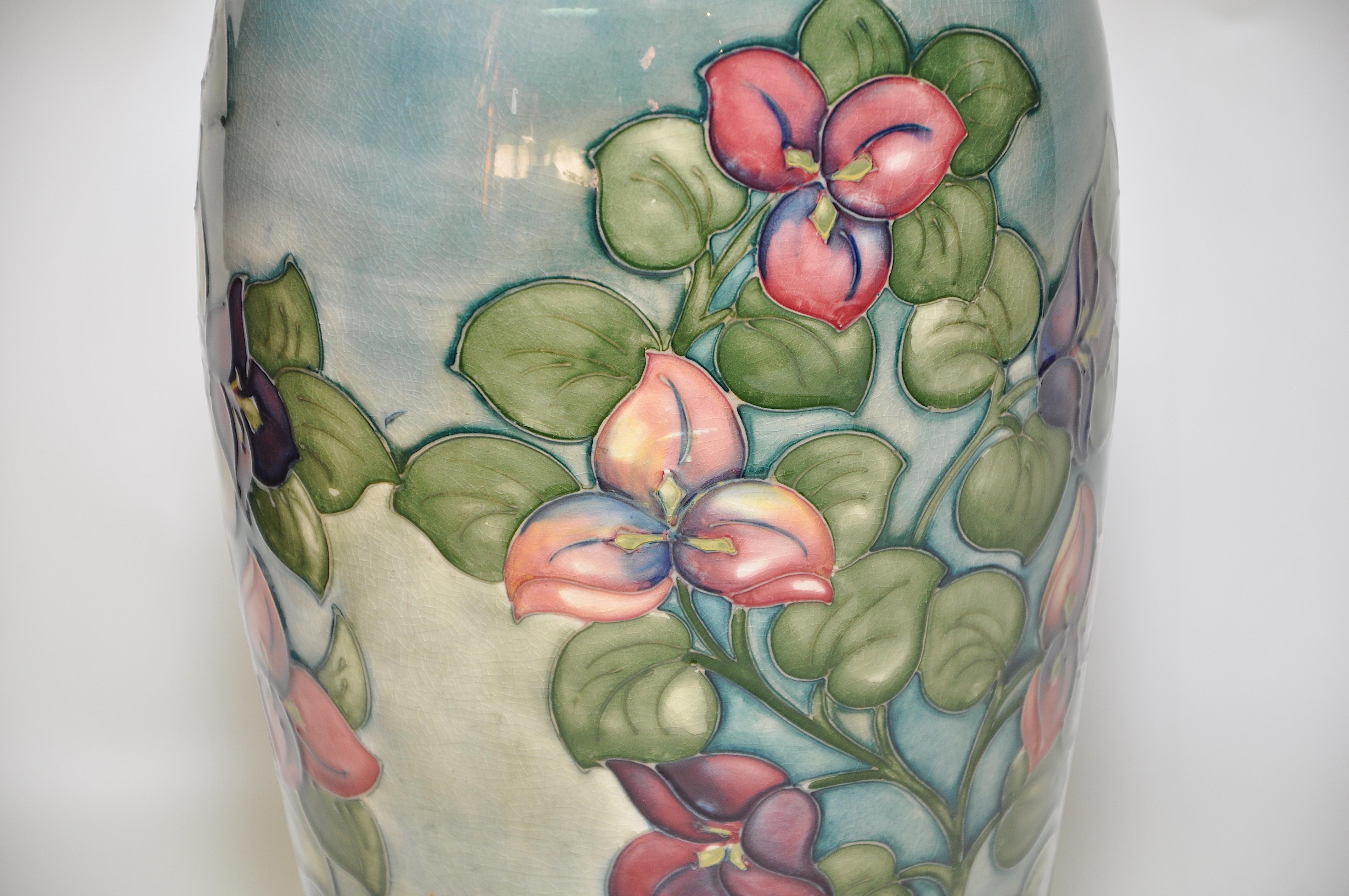 Large Moorcroft vase pot blue green Bougainvillaea flowers English art pottery.

Superb, fabulous, large Moorcroft, flamboyant, dramatic and in perfect condition. A perfect as a centre piece to dining table, collectors item, or use functionally
