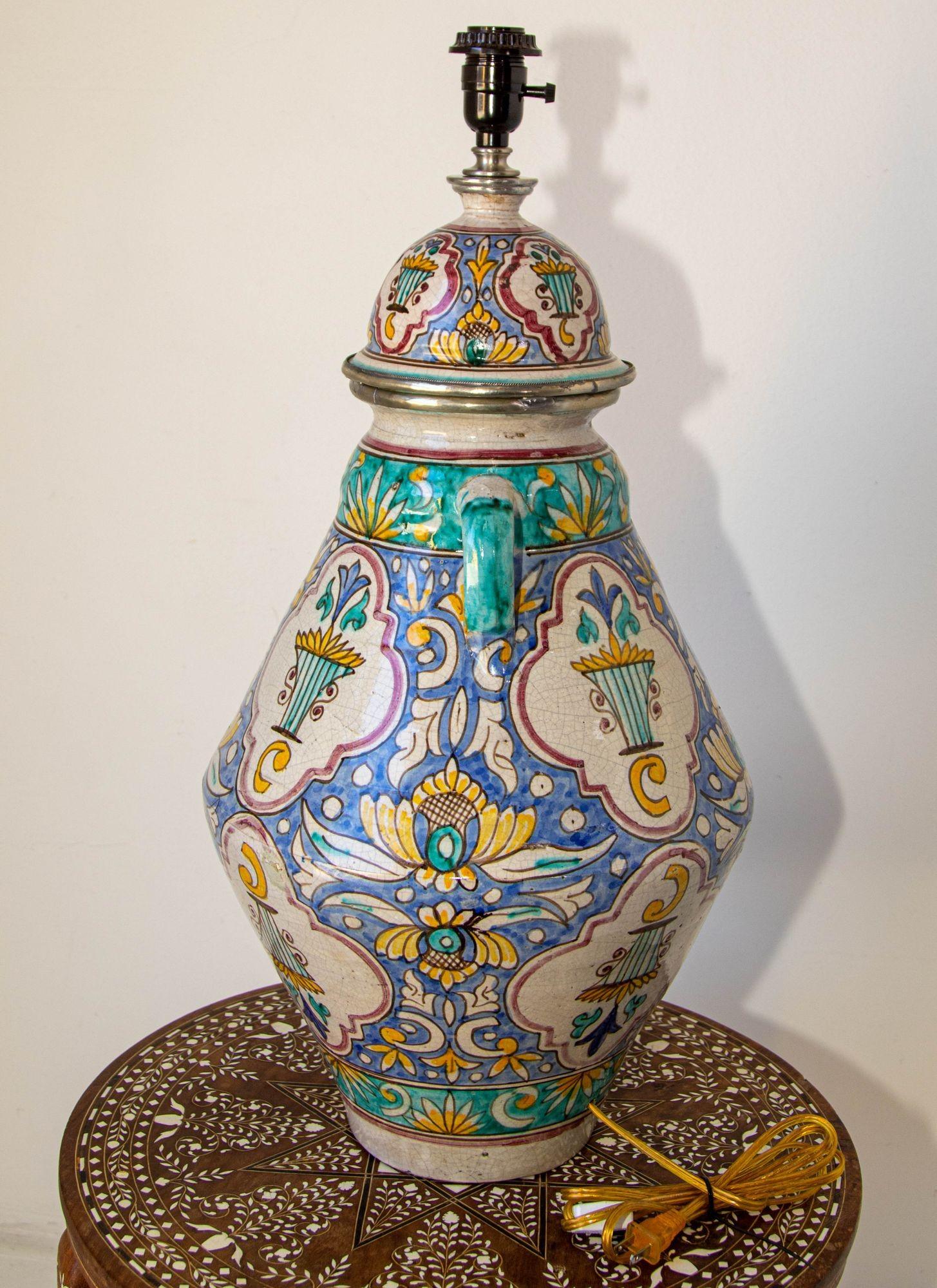 Large antique Moroccan glazed ceramic urn with lid from Fez turned into a lamp.
Large Moroccan Ceramic Table Lamp with Moorish Spanish Granada Design
Granada style ceramic handcrafted and hand-painted with Moorish foliate designs in blue, teal,