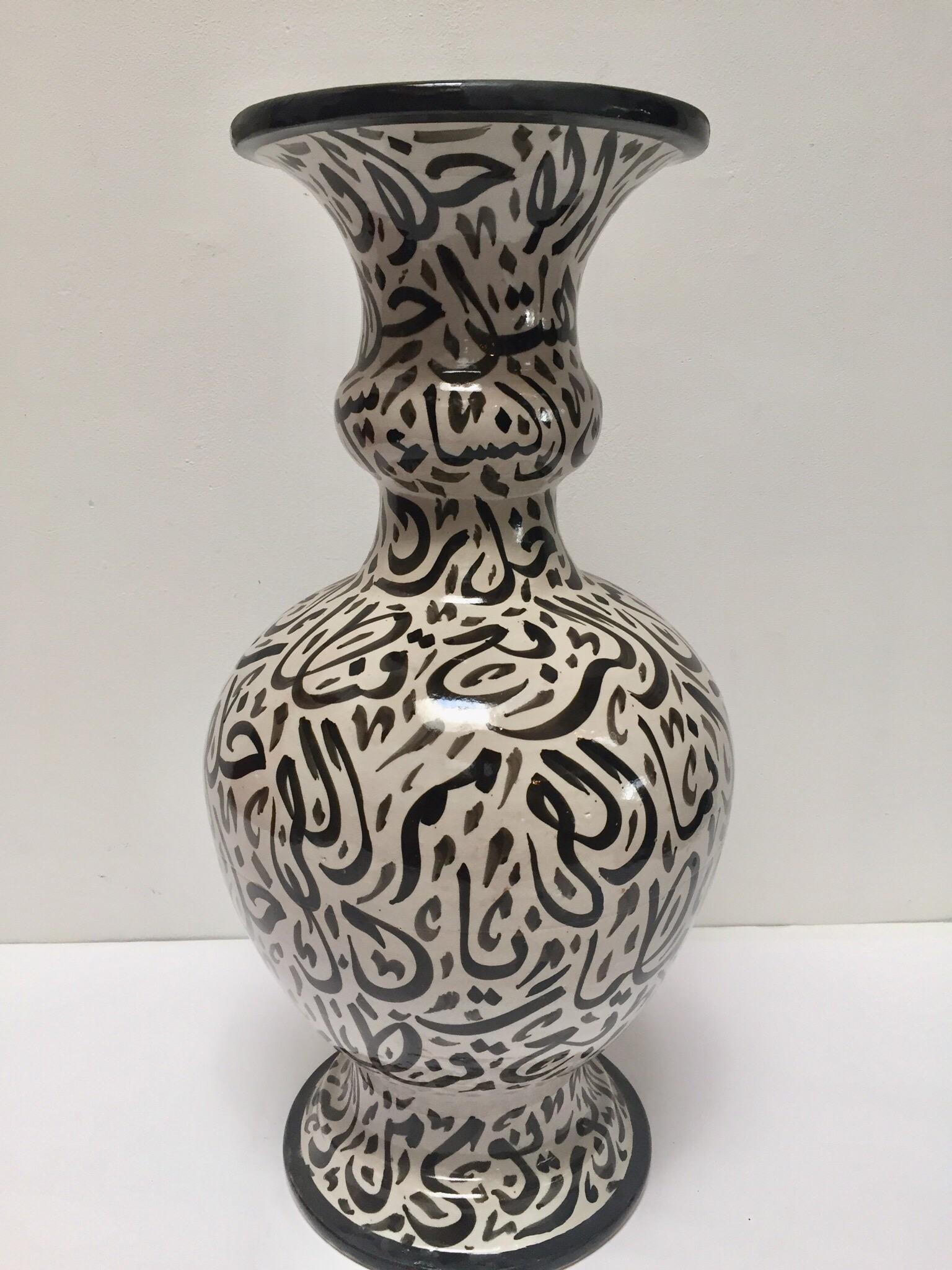 Large Moroccan glazed ceramic vase from Fez.
Moorish style ceramic handcrafted and hand painted with Arabic calligraphy writing.
This kind of art writing looks calligraphic is called Lettrism, it is a form of art that uses letters that are not