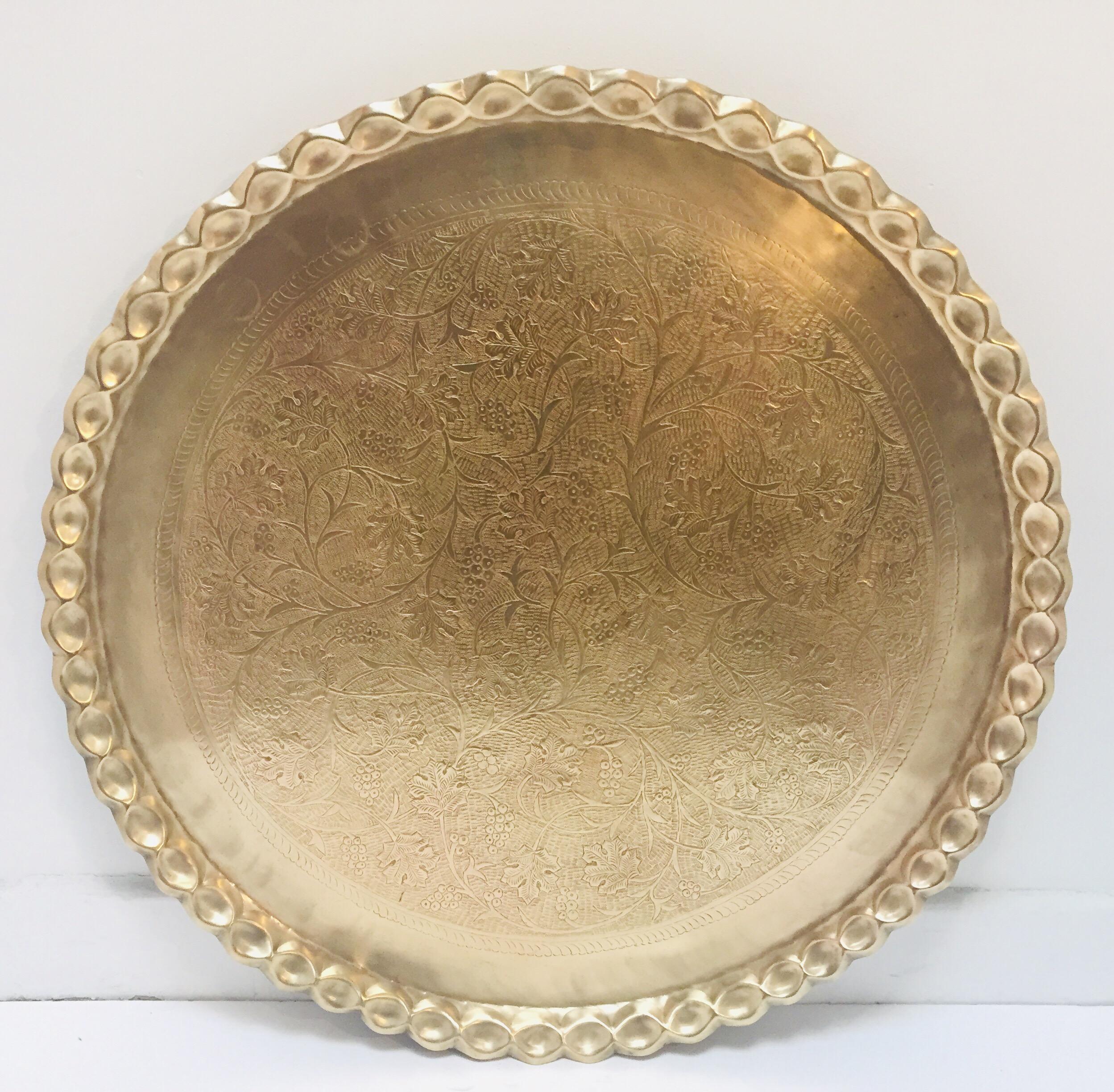 Large Moroccan round brass tray.
Engraved and embossed large 39.5 inches round midcentury Moroccan brass tray.
Polished brass Moroccan tray, very good condition.
Very hard to find 39.5 inches diameter large metal hand-hammered brass tray .
Middle