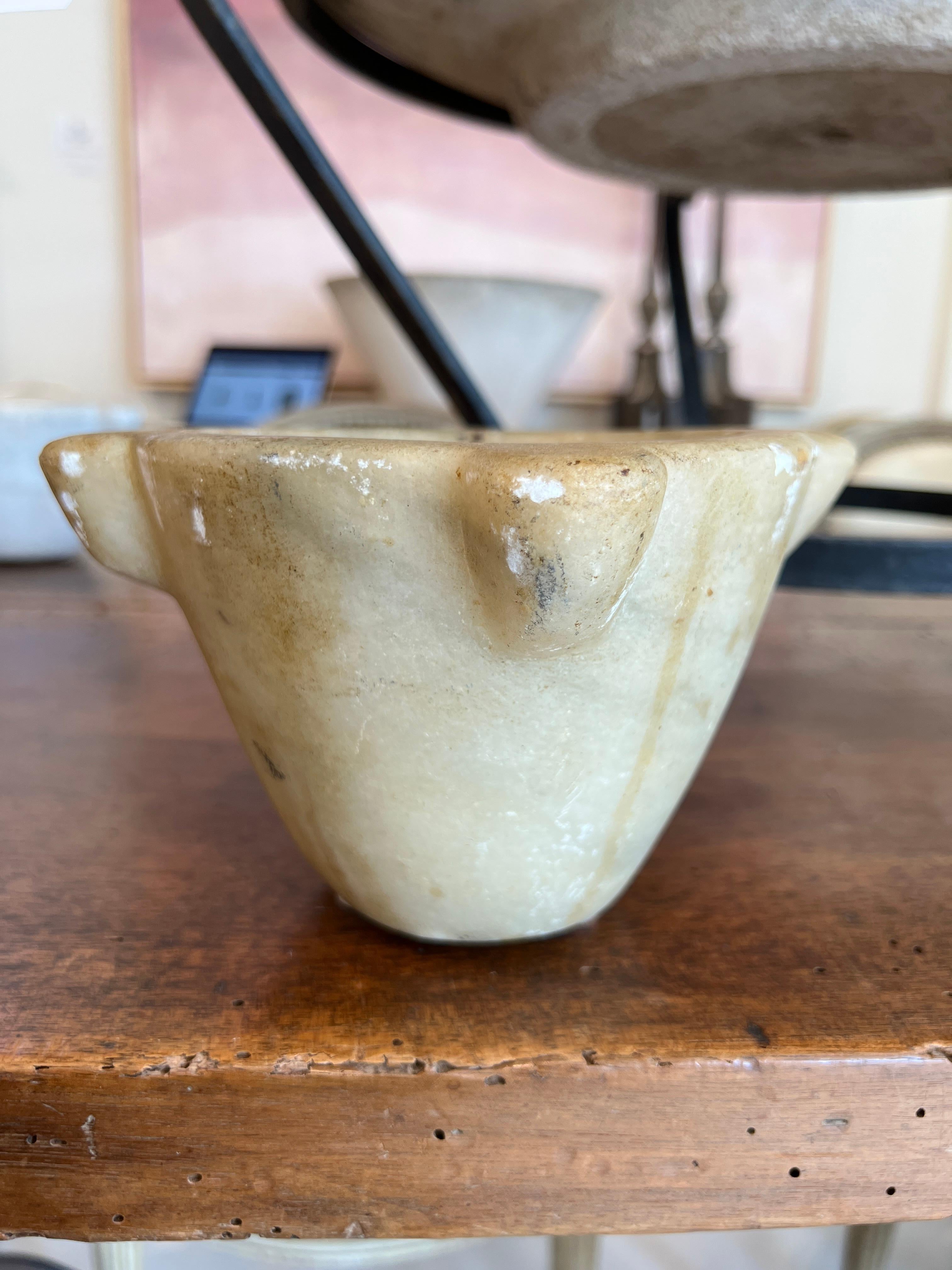 Beautiful marble mortar for crushing spices or just sitting as a decorative accessory.